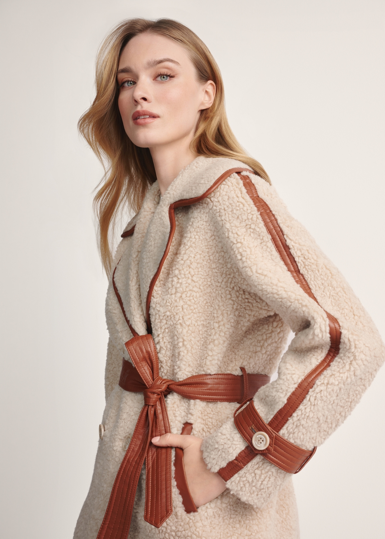 Women's beige fur coat with wool FUTDP-0035-80(Z 25) - front view of the product on a model against a white background. Half of the silhouette visible.