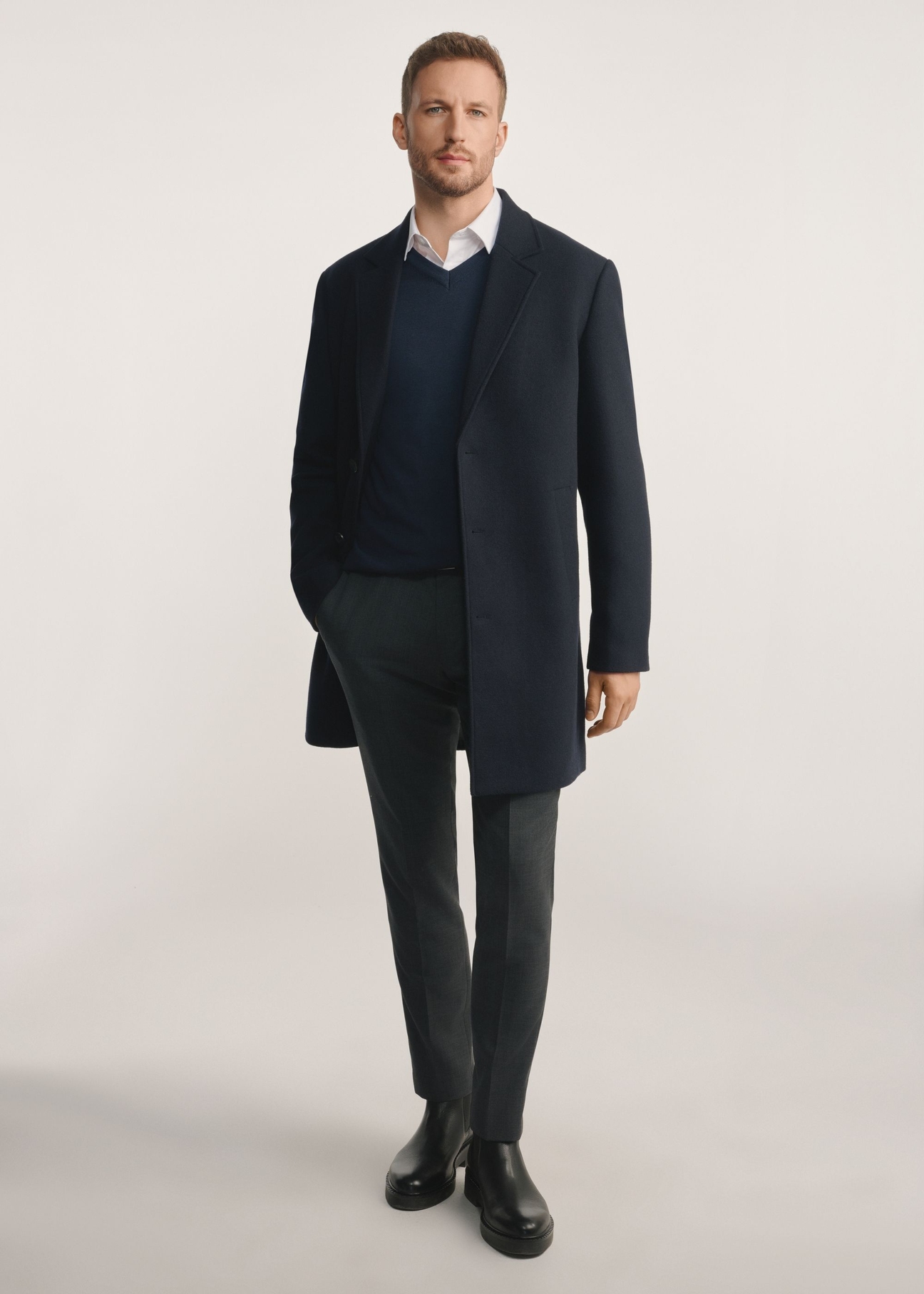Navy blue men's coat PLAMT-0006-69(Z25), product visible from the front on the model, the entire silhouette is visible.