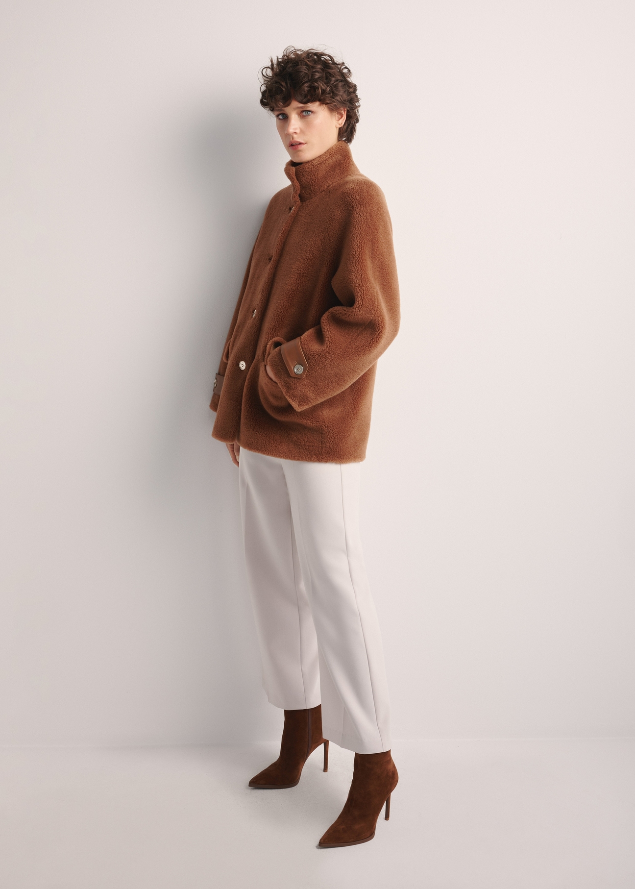 Women's woolen fur coat in camel color FUTDW-0032-24(Z25) - side view of the product on a model on a white background. The entire silhouette is visible.