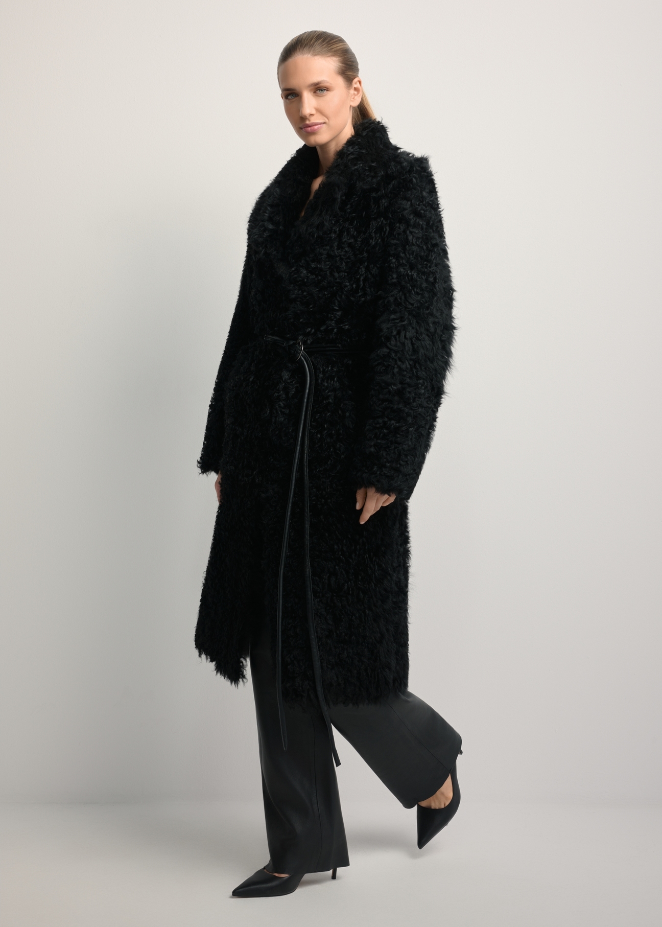 Black double-sided women's sheepskin coat KOZDS-0091-1395(Z25), front view of the product on a model. Full body visible.