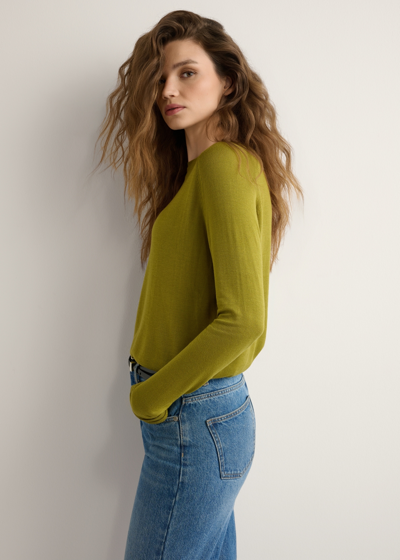 Thin olive women's sweater SWEDT-0257-8E(W26), side view of the product on the model. Half of the silhouette visible.