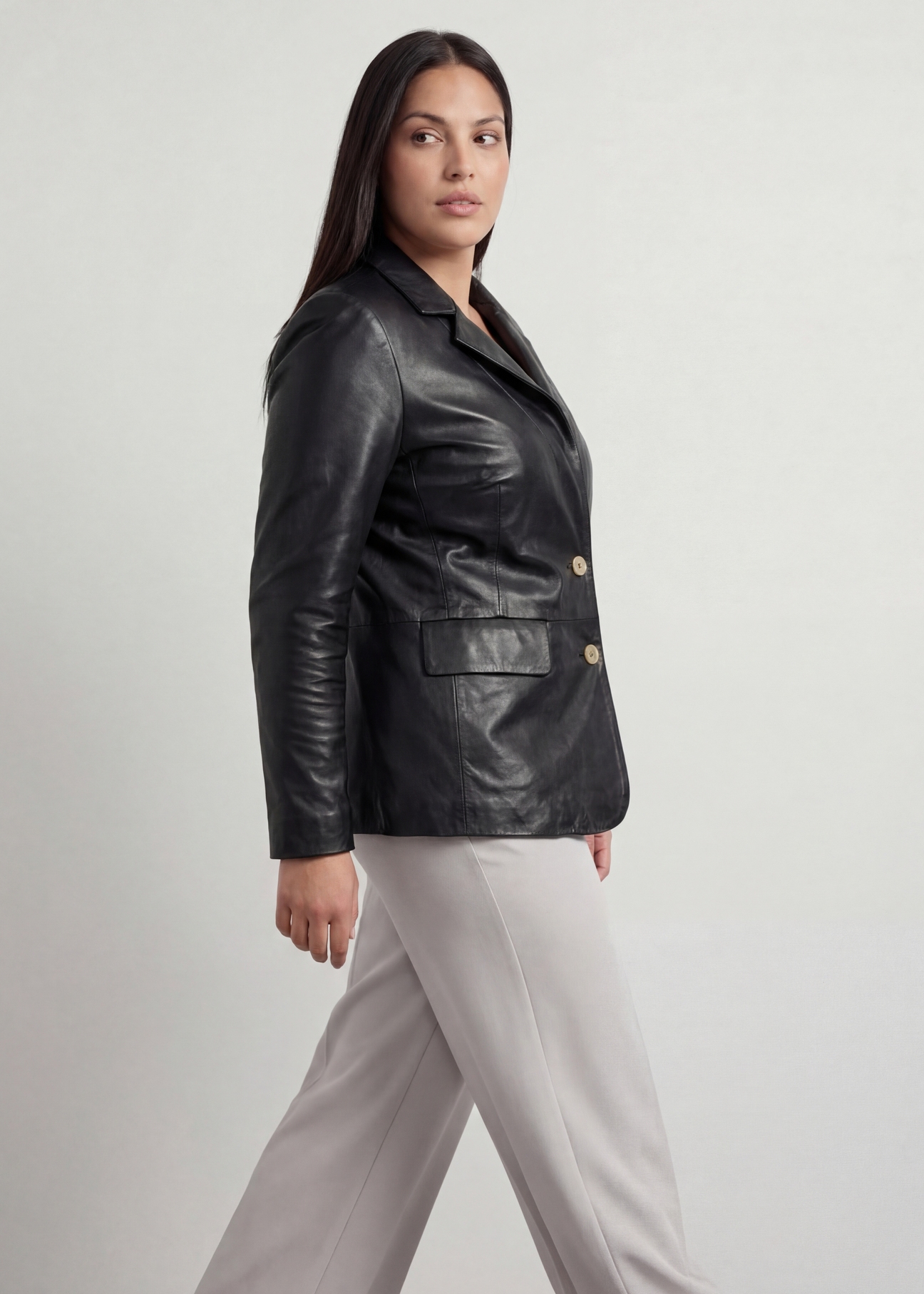 Women's black PLUS SIZE leather jacket KURDS-0645L-99(W26), side view of the product on the model, half of the silhouette visible.