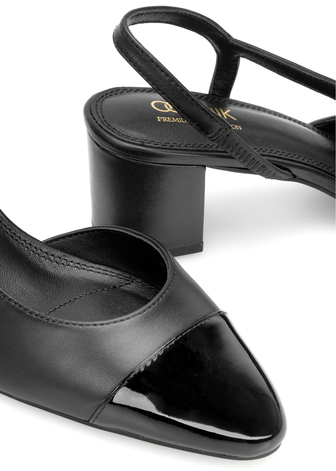 Black leather pumps with open heel BUTYD-1173-99(W26), close-up of the product detail on a white background.