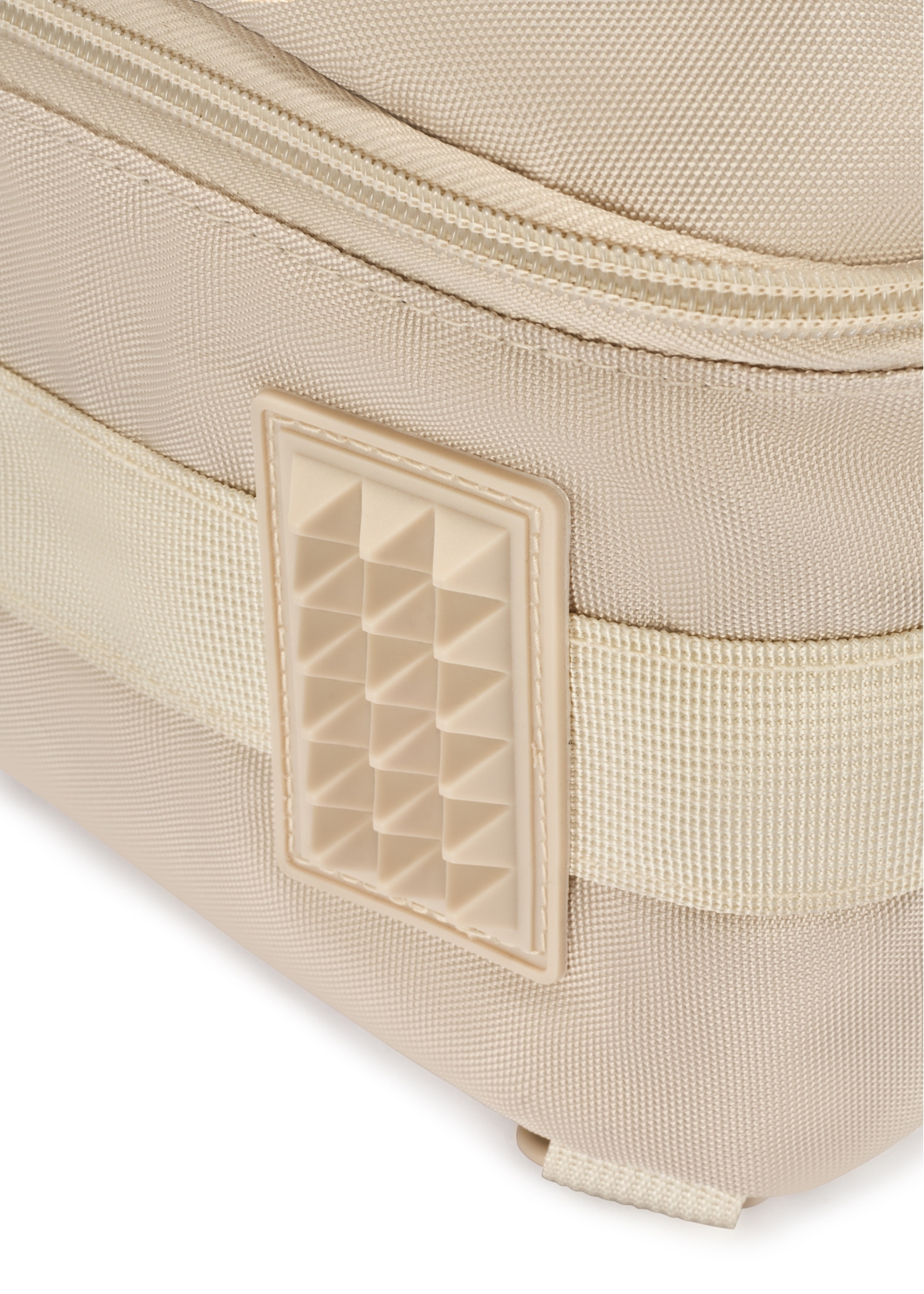 Beige airplane backpack PLCMN-0017-16(Z25), close-up of the leg, view on a white background.