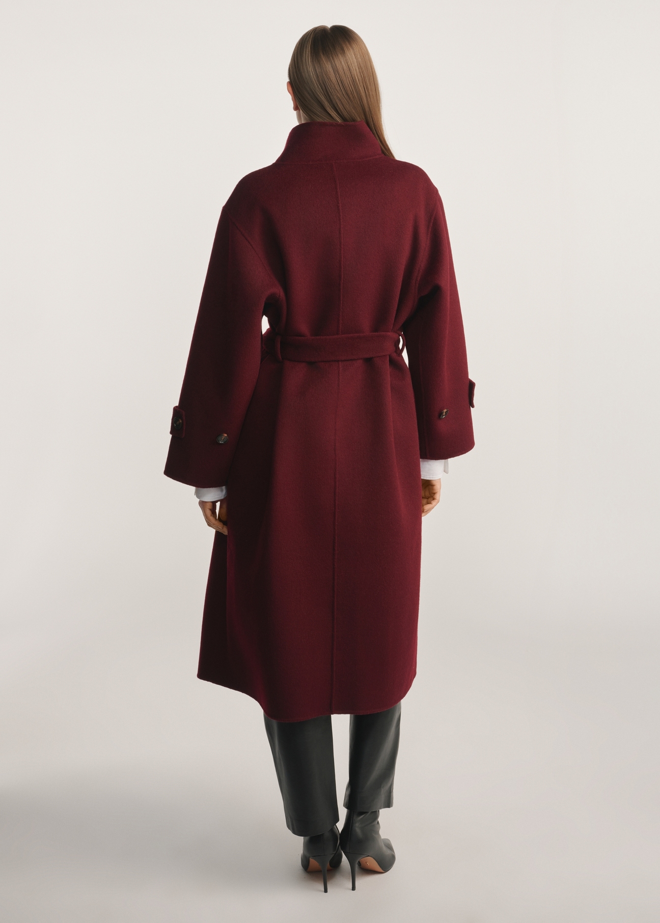 Burgundy women's coat PLADT-0068-49(Z25), product visible from the back on the model, the entire silhouette is visible.