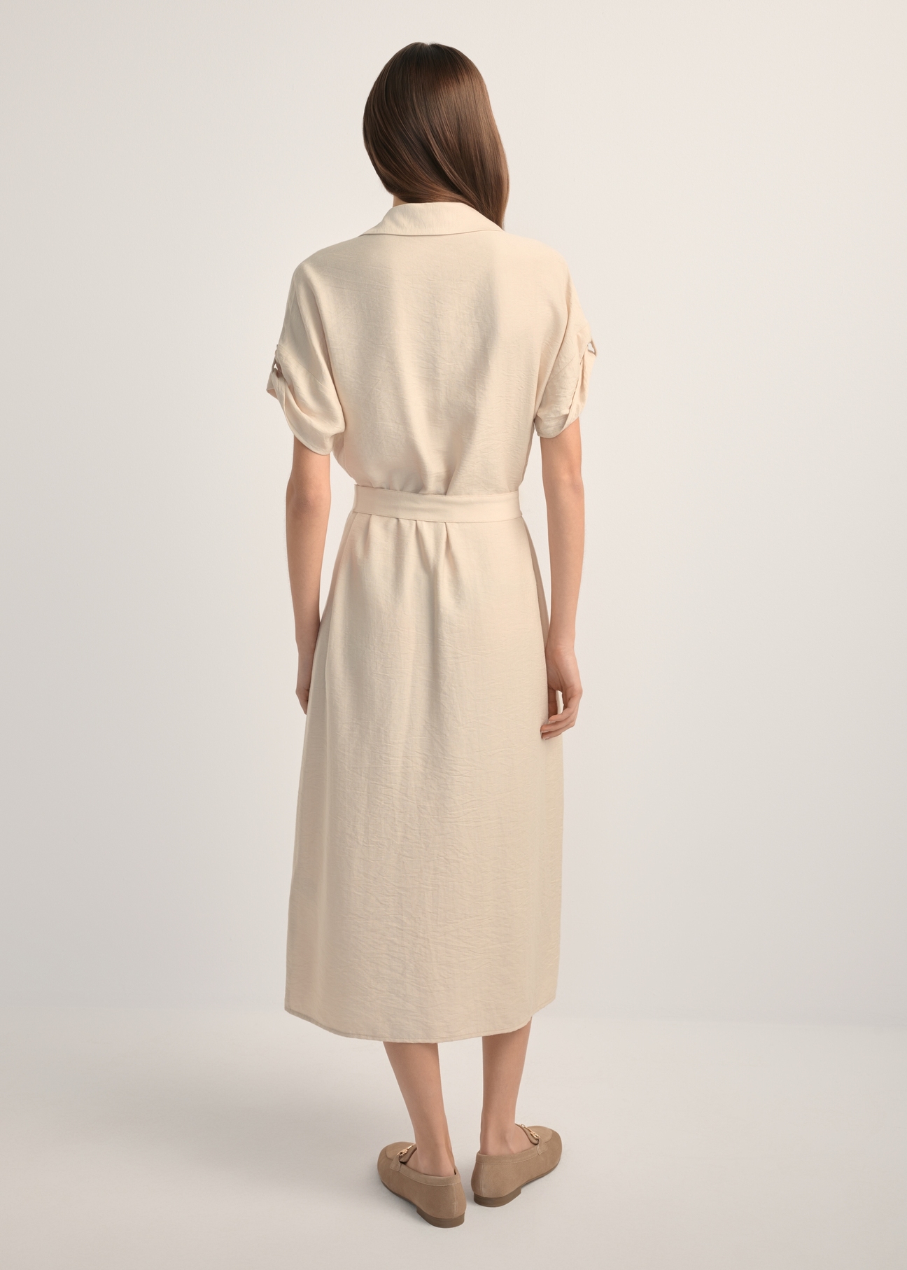 Light beige long dress with short sleeves SUKDT-0180A-1A(W26), back view of the product on the model. Full body visible.