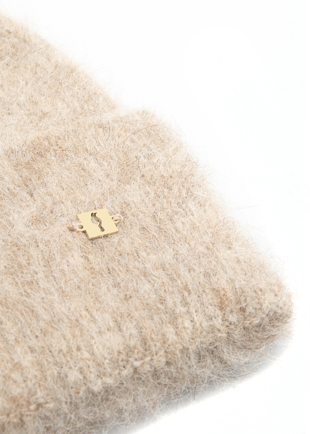 Beige woolen women's hat CZADT-0212-81(Z25), close-up of the product detail on a white background.