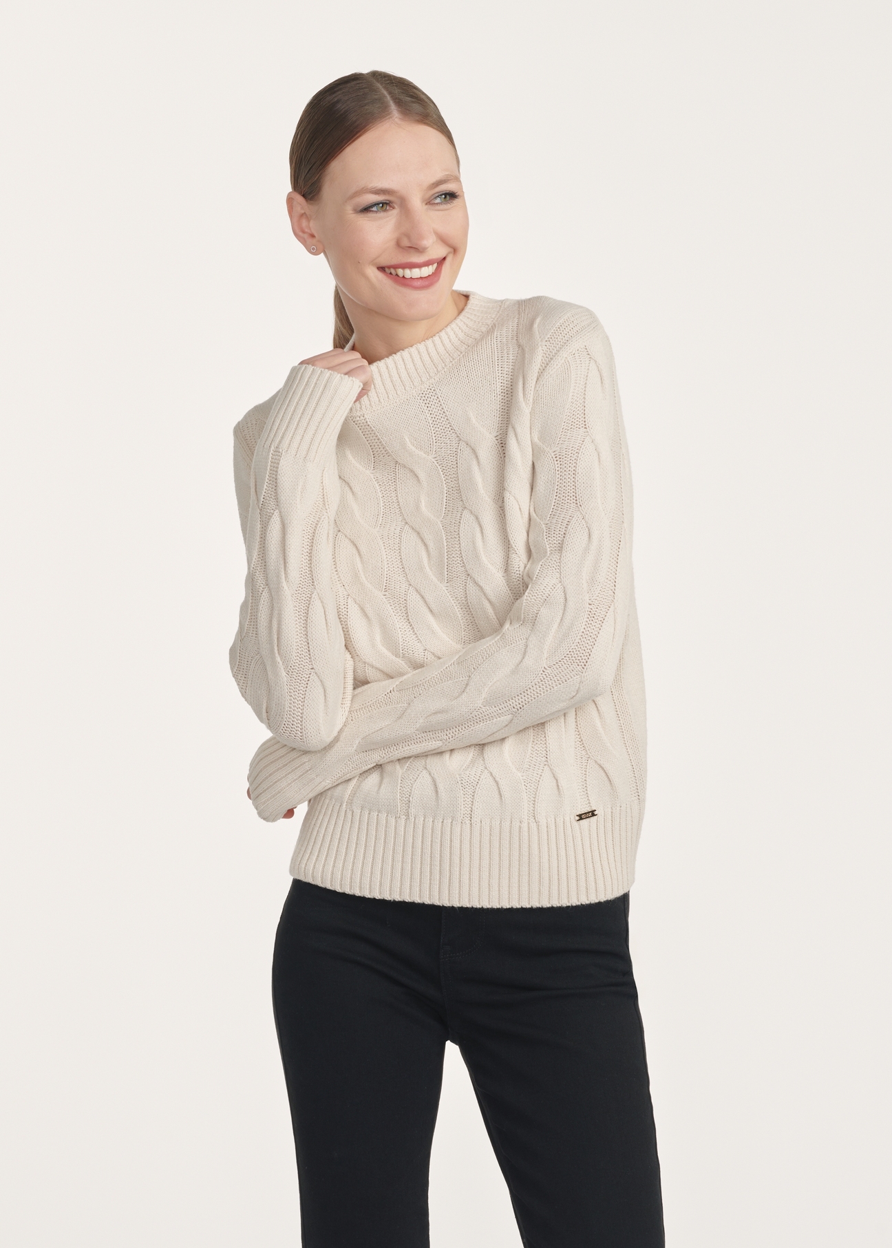 Light beige women's sweater with decorative weave SWEDT-0210-80(Z25), front view of the product on the model. Half of the silhouette visible.