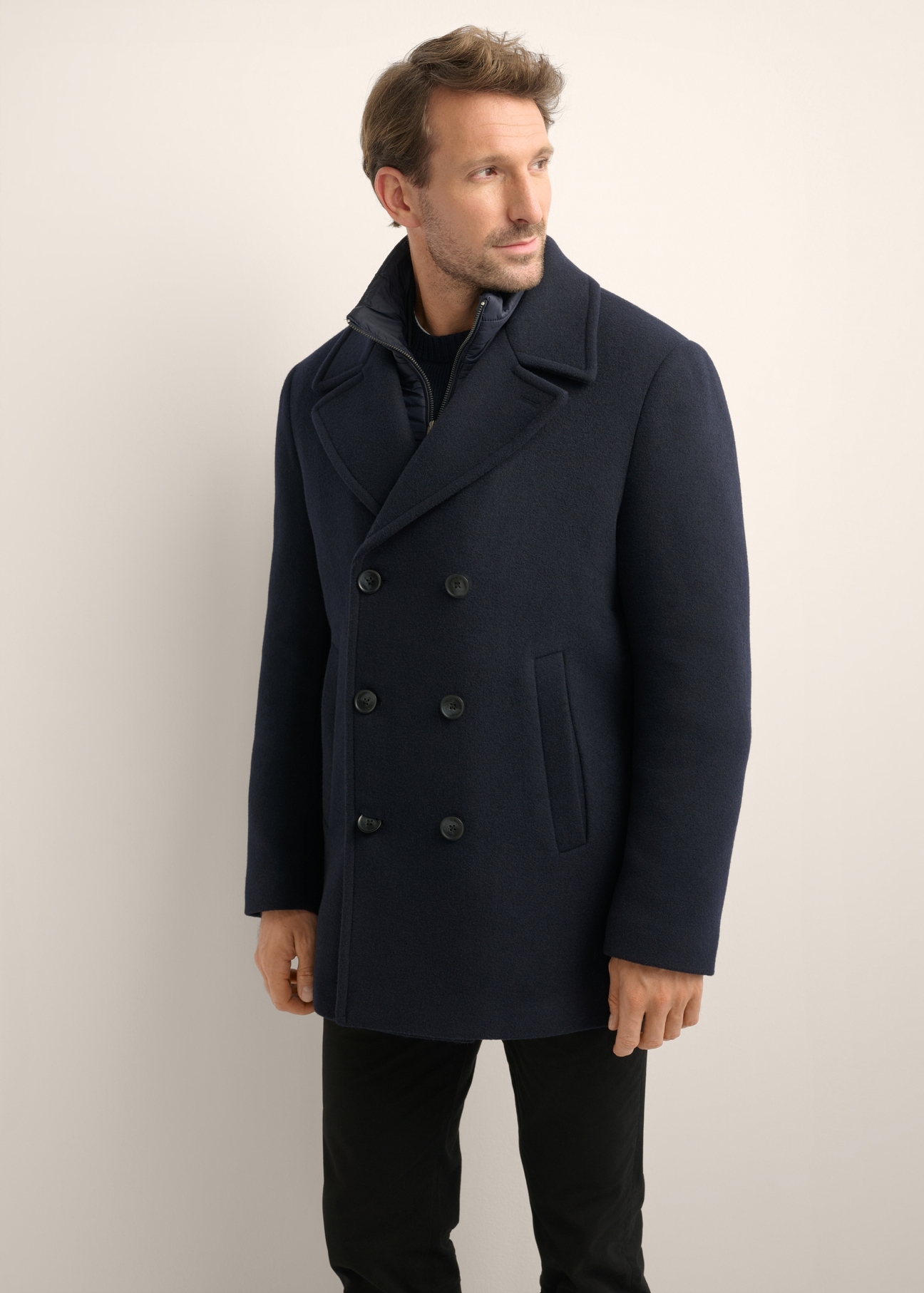 Men's dark navy wool coat PLAMT-0012-7E(Z26), front view of the product on the model. Half of the silhouette visible.