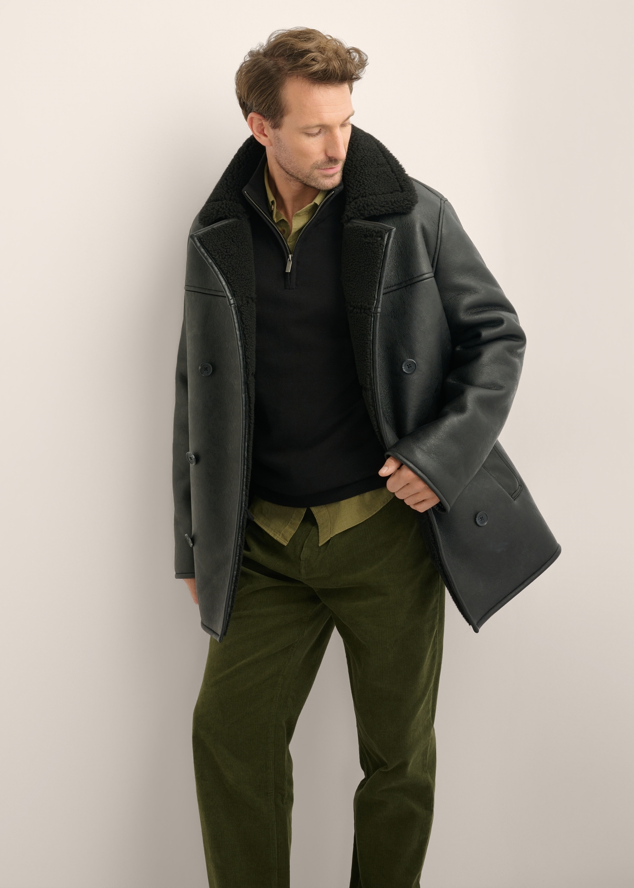 Men's black sheepskin coat KOZMP-0012-99(Z26), front view of the product on the model. Half of the silhouette visible.