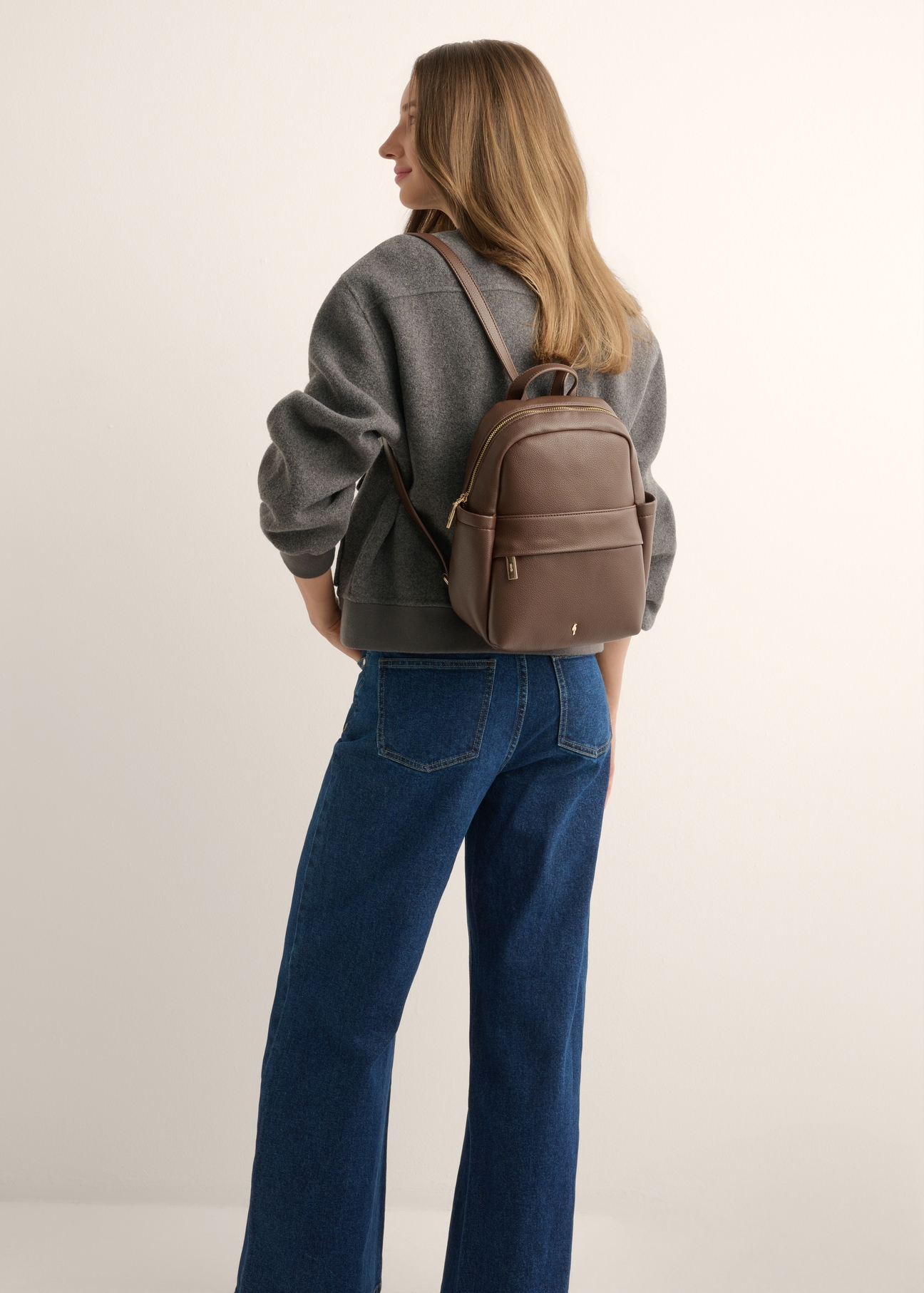 Brown women's imitation leather backpack TOREC-1246-1H(Z26), product view of a model's silhouette on a light background.