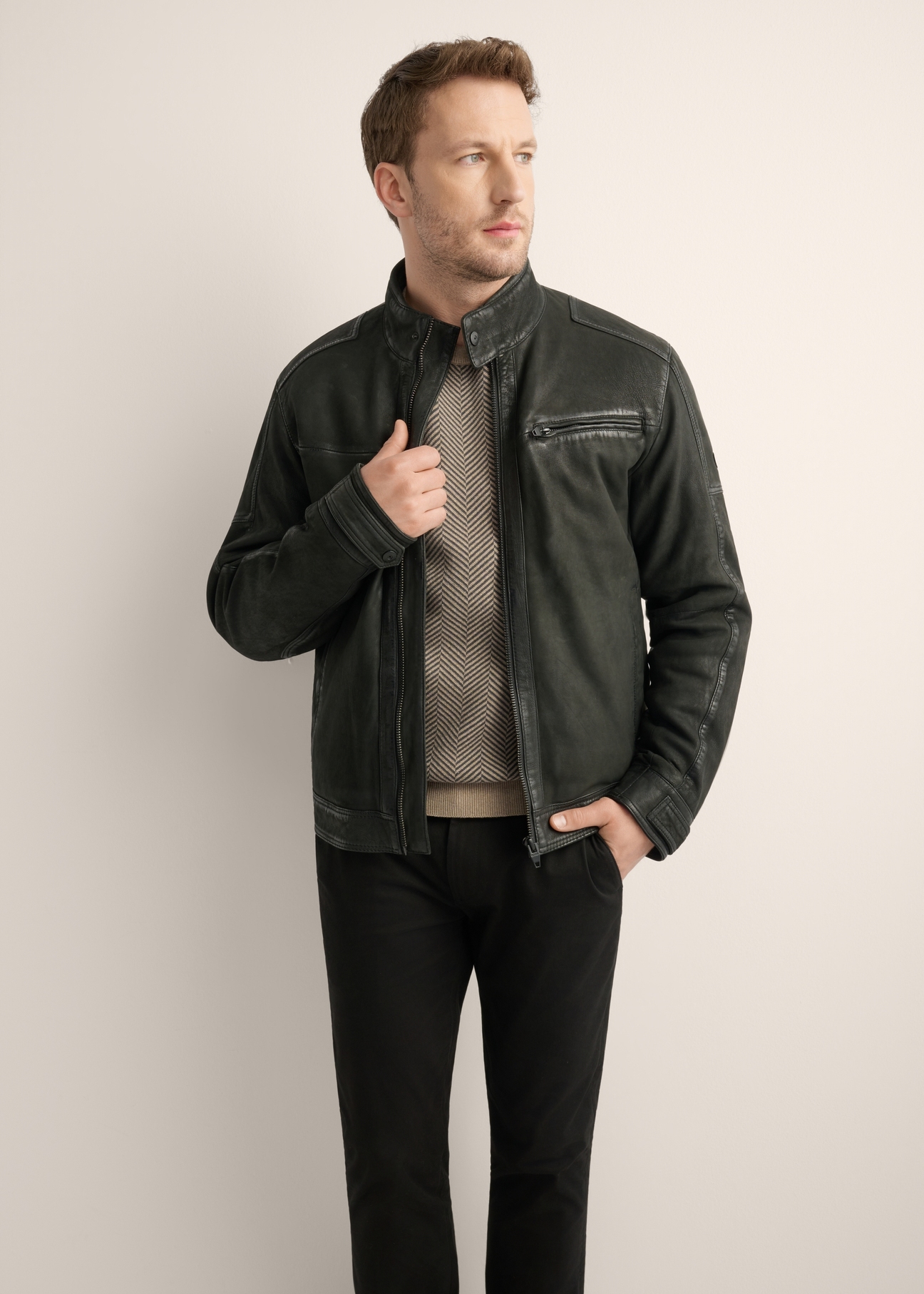 Black men's leather jacket KURMS-0420-99(Z26), front product view on model. Half silhouette visible.