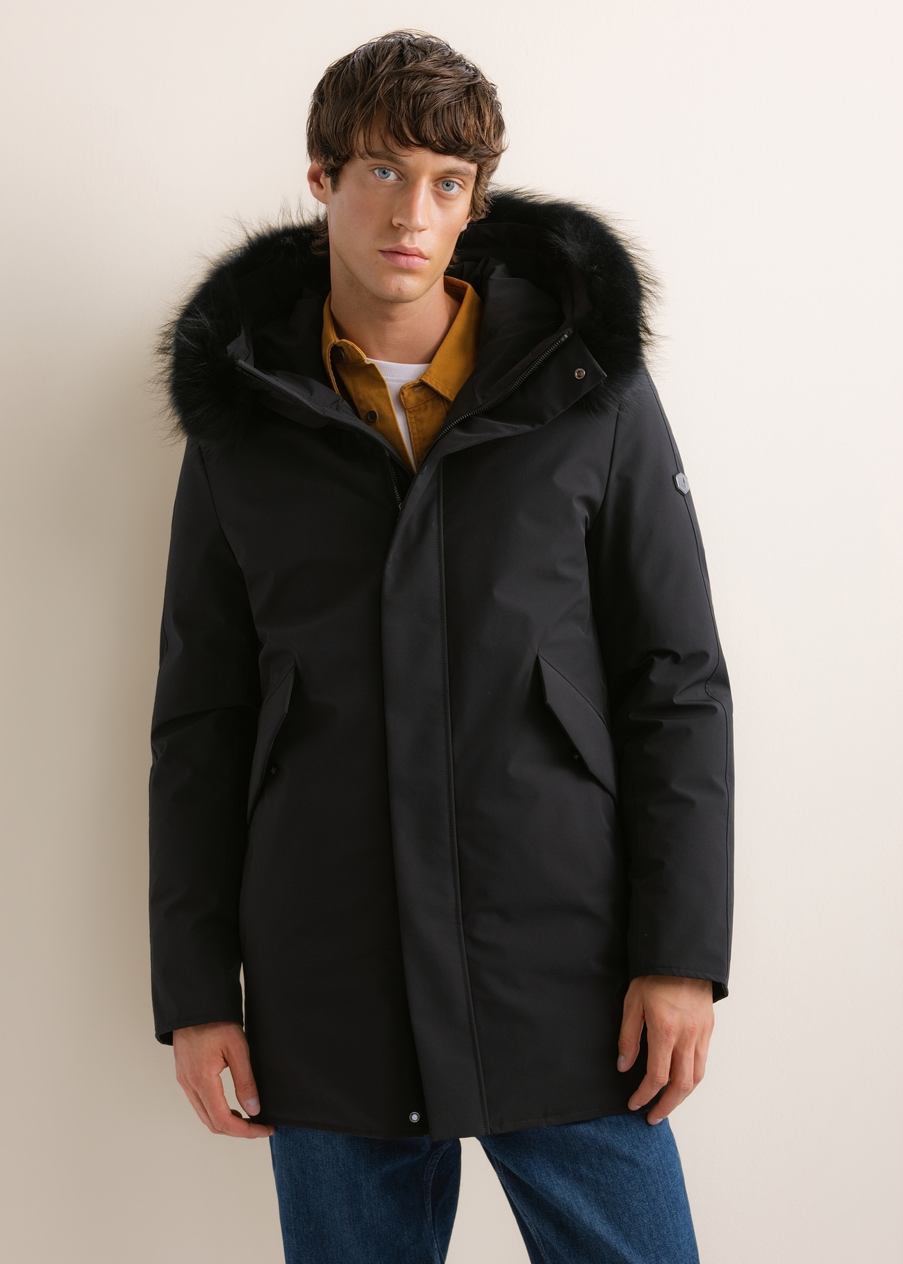 Men's black winter jacket KURMT-0446-99(Z26), front view on a model. Half-body shot.