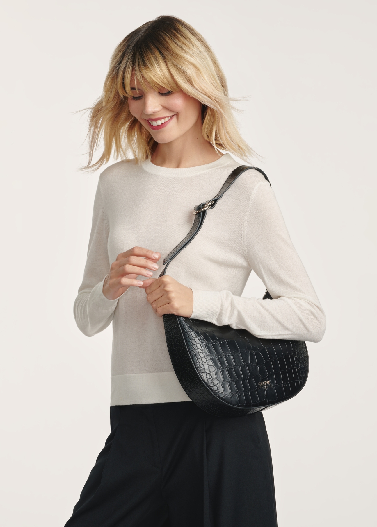 Black leather croco handbag TORES-1172-99(Z25) - product view on a model on a white background. Half of the silhouette visible.