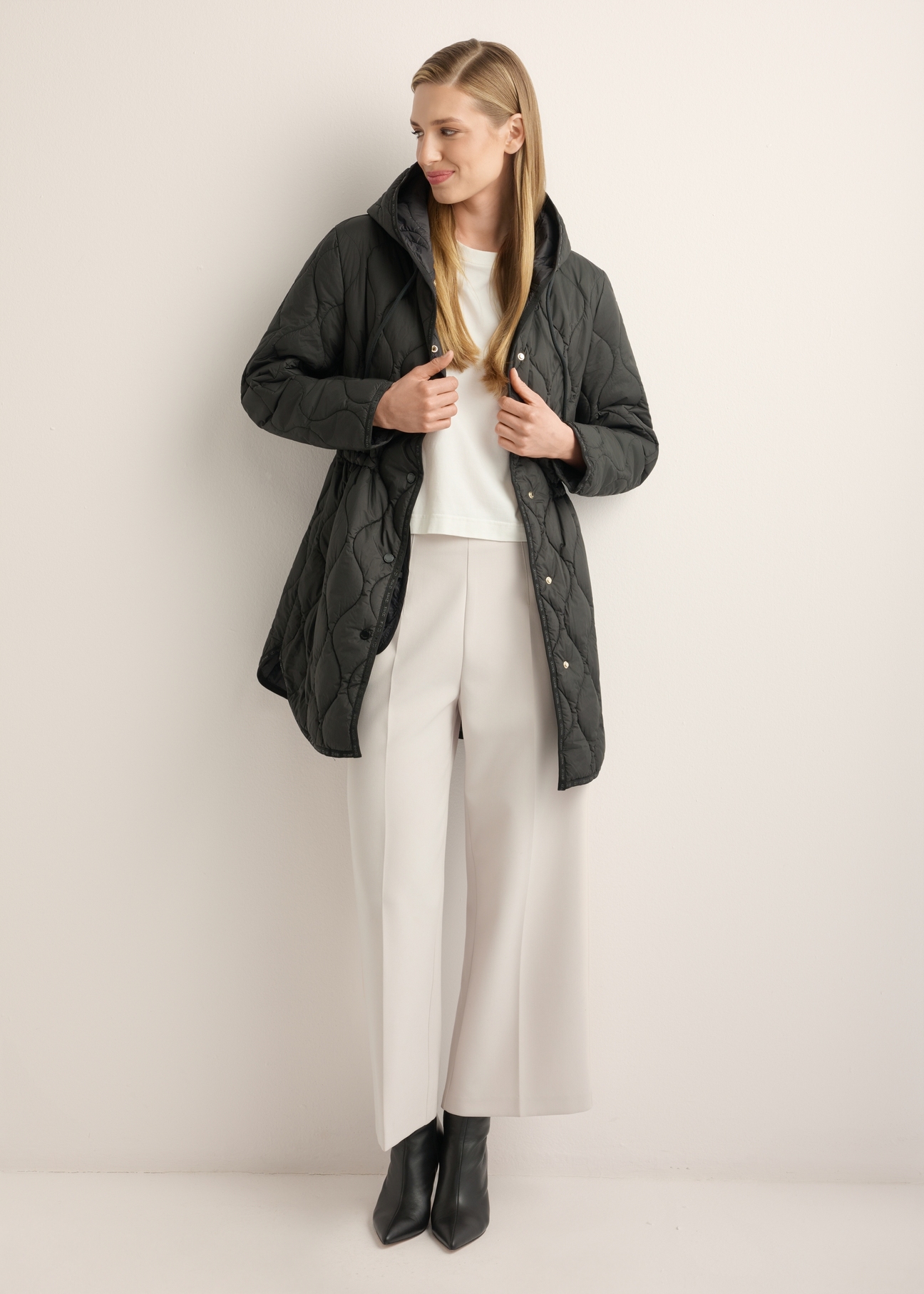 Women's black quilted jacket KURDT-0654-99(W26), front view of the product on the model. Full body visible.