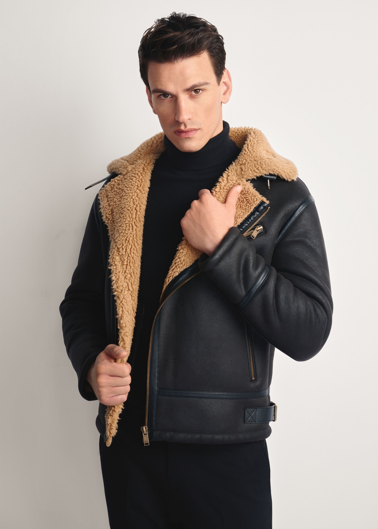 Dark brown men's sheepskin coat KOZMP-0002-1I(Z26), front view of the product on the model, half of the silhouette visible.