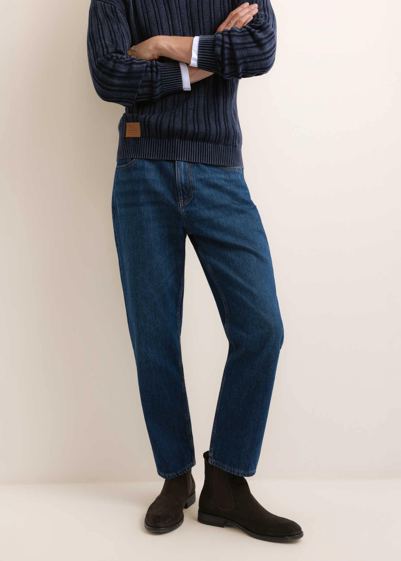 Blue men's denim pants JEAMT-0026-7C(Z26), front view of the product on the model. Half of the silhouette visible.