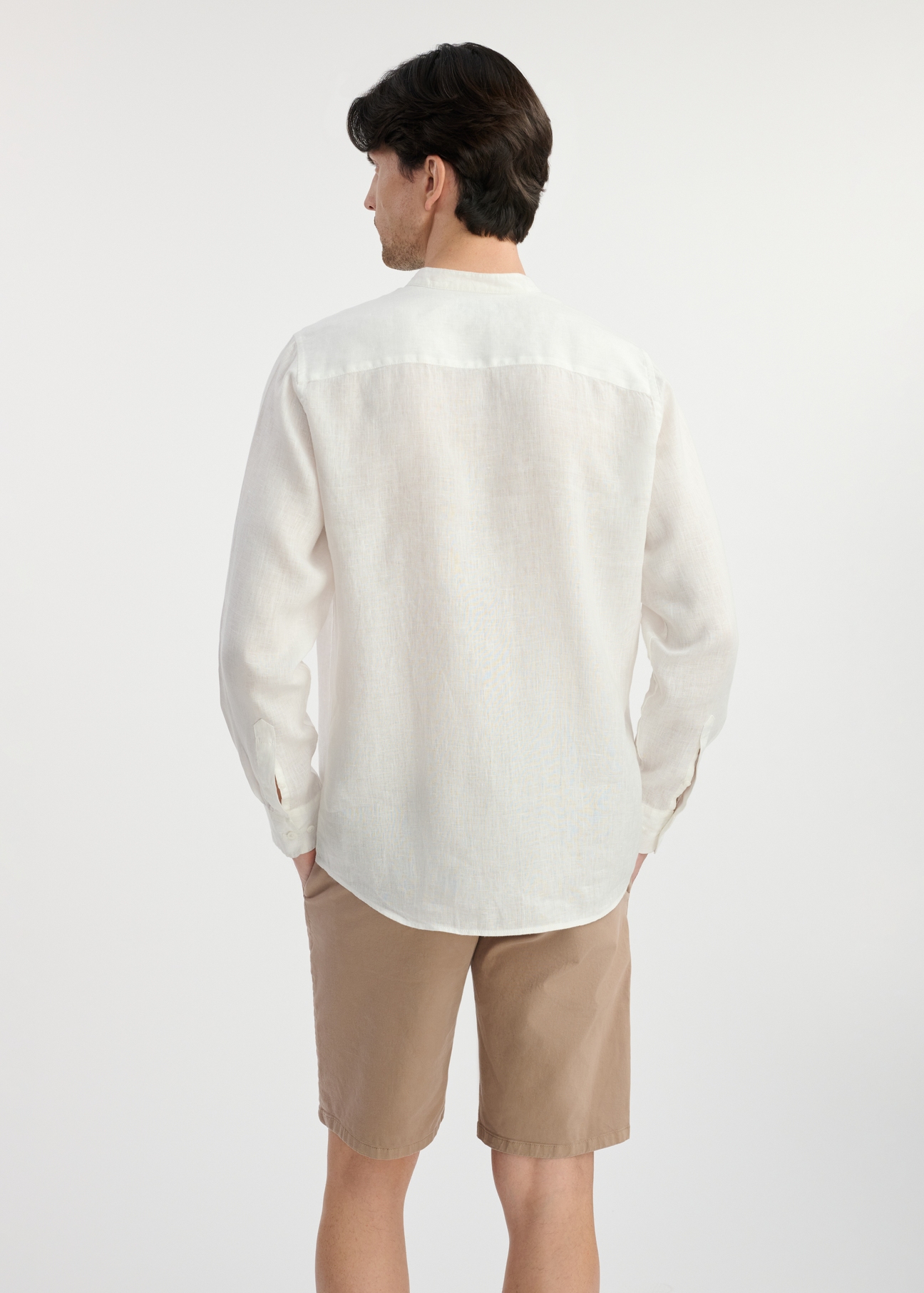 White linen men's shirt KOSMT-0337-12(W25) - back view on the model on a white background. Half of the silhouette visible.