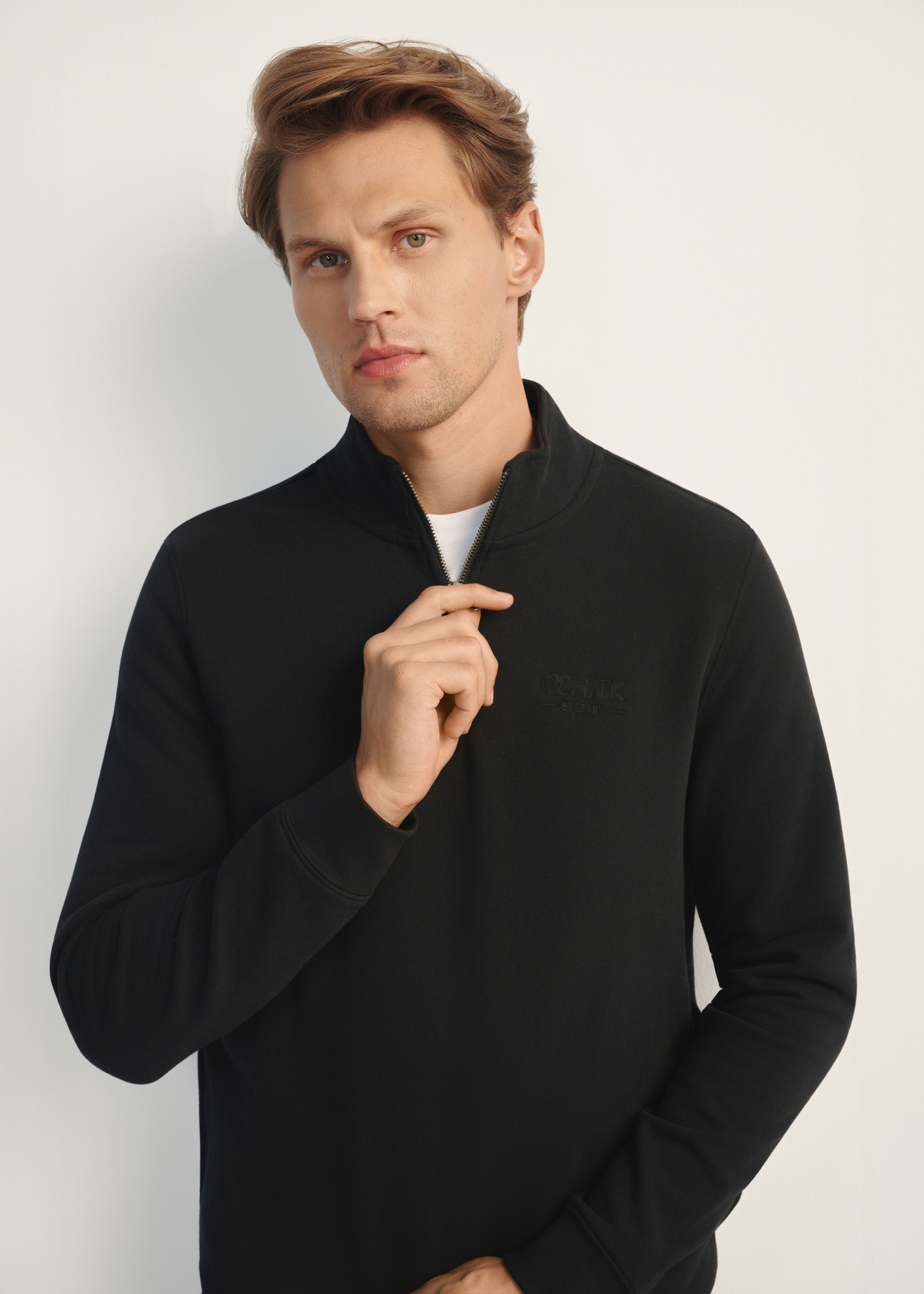 Men's black hooded sweatshirt BLZMT-0067-99(Z25), front view of the product on the model. Half of the silhouette visible.