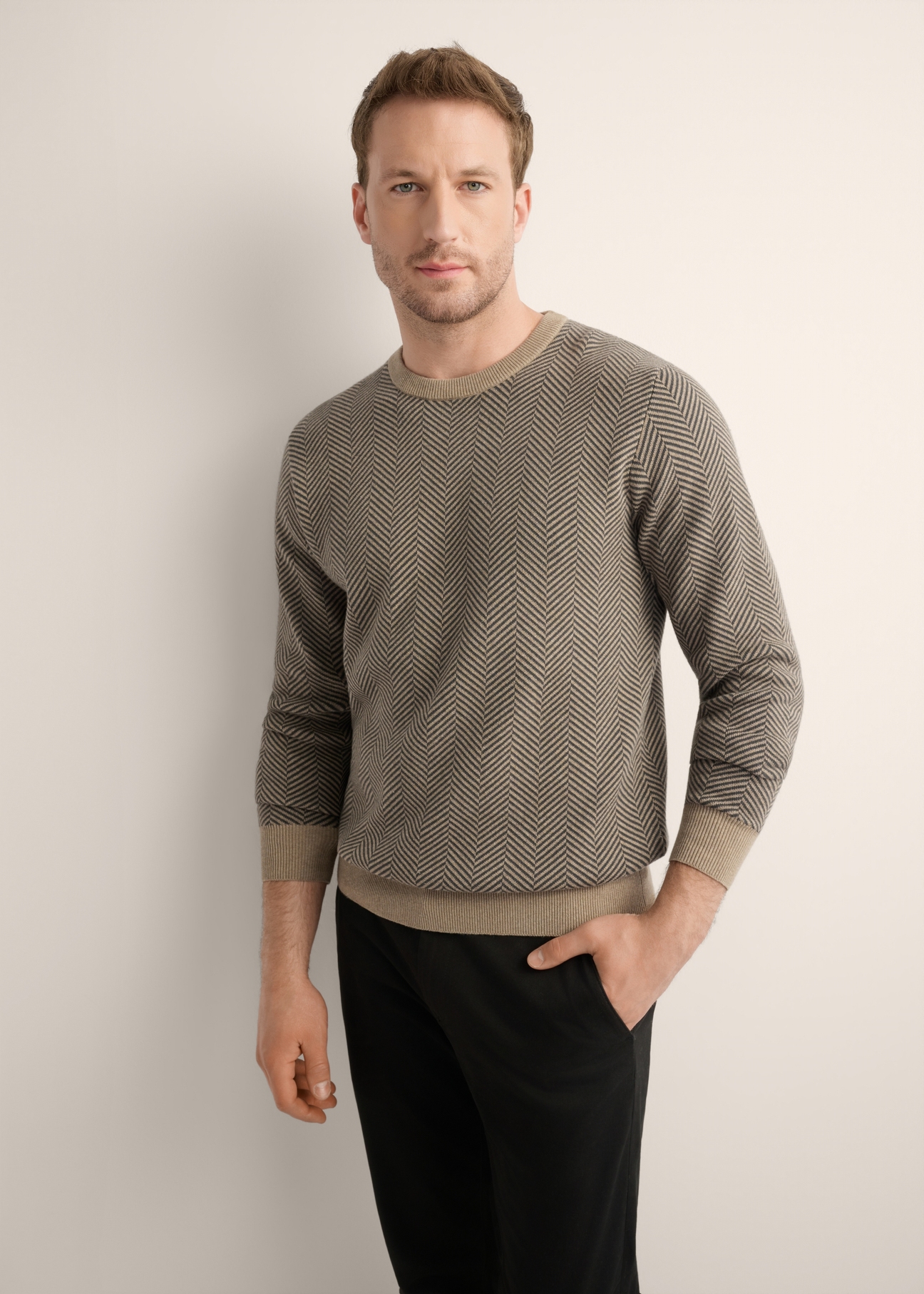 Men's dark beige patterned sweater SWEMT-0195-1D(Z26), front view of the product on the model. Half of the silhouette visible.