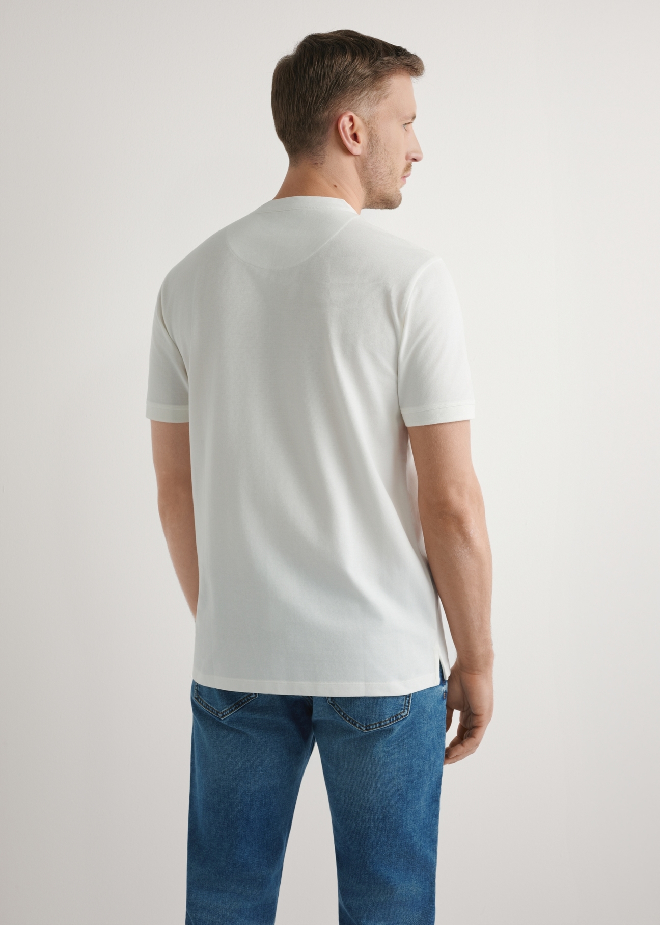 Cream men's polo shirt POLMT-0061-0B(W26), back view of the product on the model. Half of the silhouette visible.