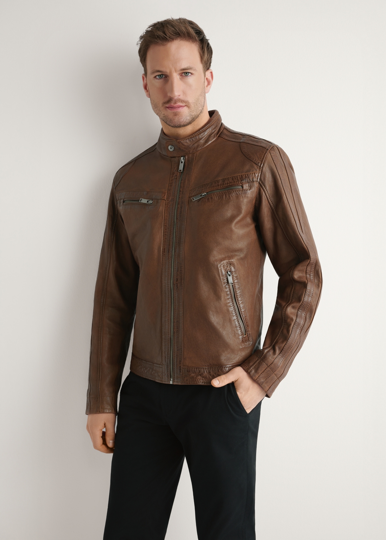 Men's leather jacket in cognac color KURMS-0397-1F(W26), front view of the product on the model. Half of the silhouette visible.