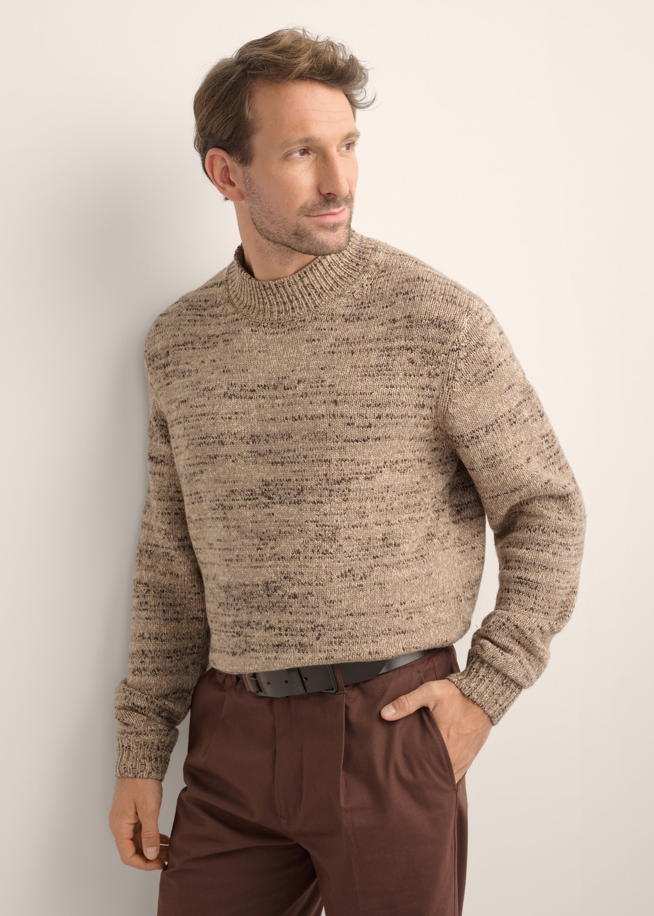 Brown men's sweater SWEMT-0194-1K(Z26), diagonal view of the product on the model. Half of the silhouette visible.