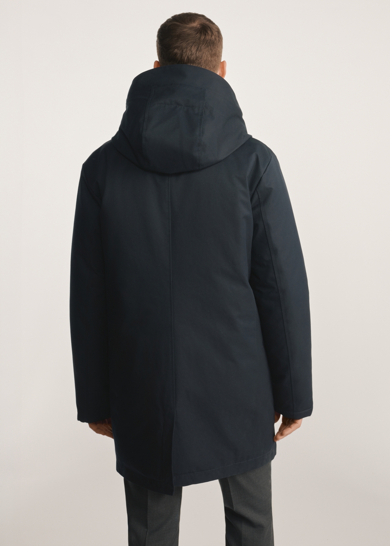 Navy blue men's winter jacket KURMT-0387-69(Z25), product visible from the back on the model, half of the silhouette visible.