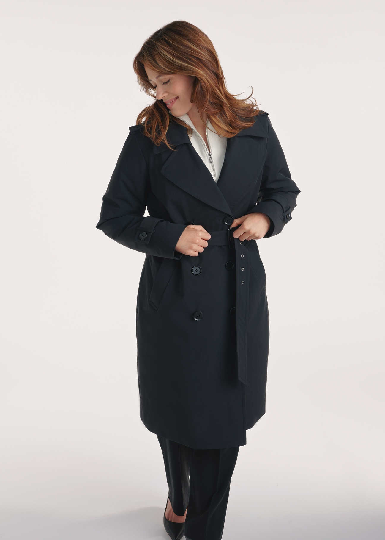 Black women's coat with insulation KURDT-0610-99(Z25), front view of the product on the model, half of the silhouette visible.
