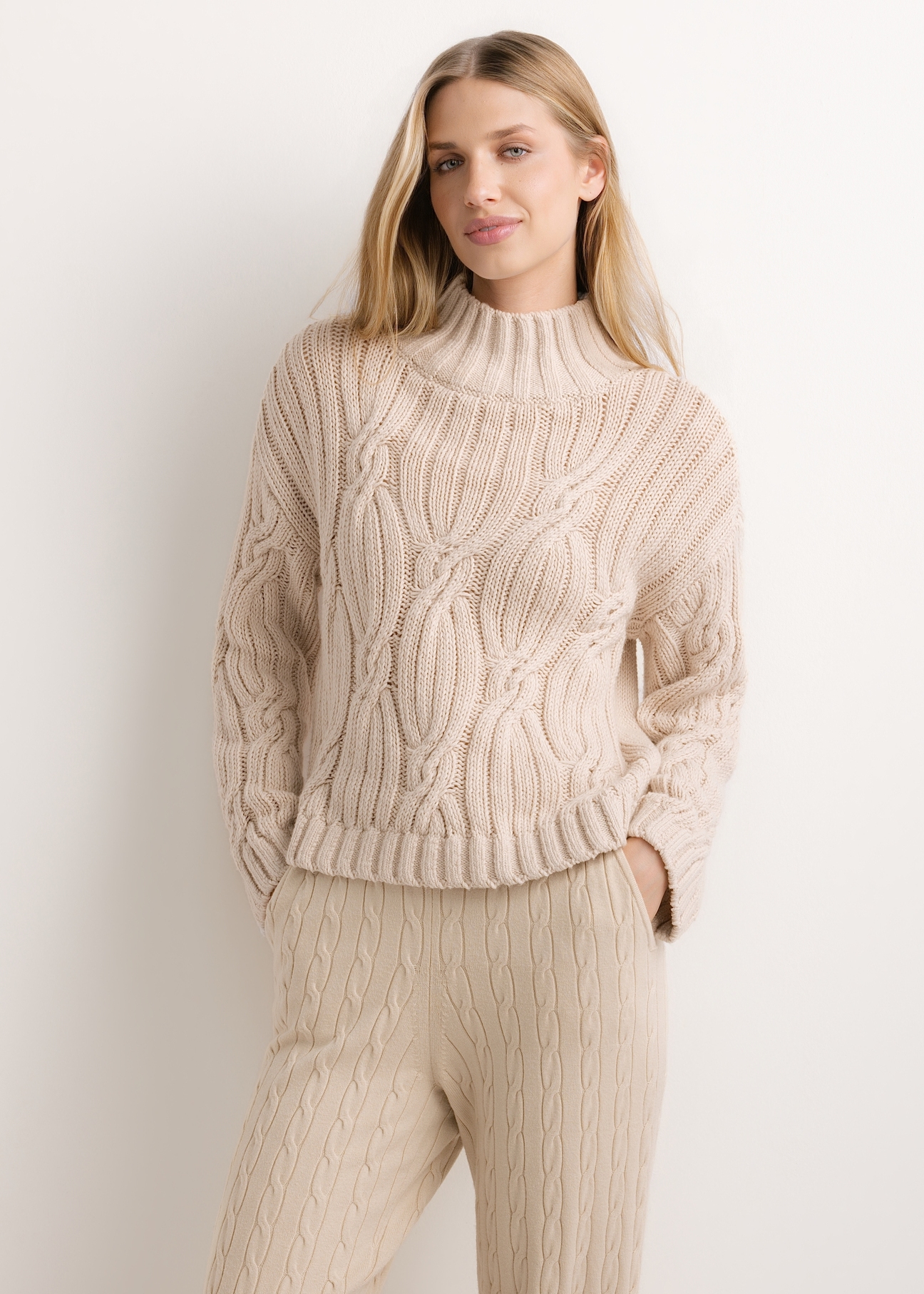 Women's oversized sweater in light beige SWEDT-0278-1A(Z26), product view from the front on the model. Half of the silhouette visible.