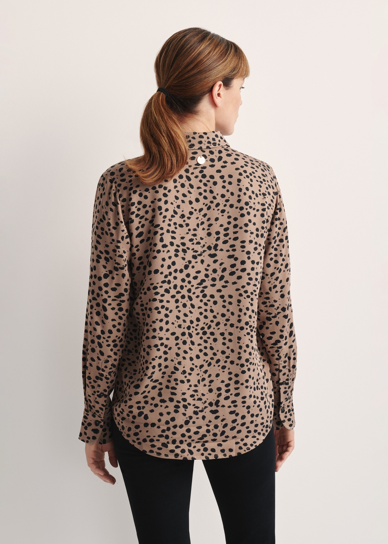 Dark beige women's shirt KOSDT-0173-24(Z25), product view from the back on the model, half of the silhouette visible.
