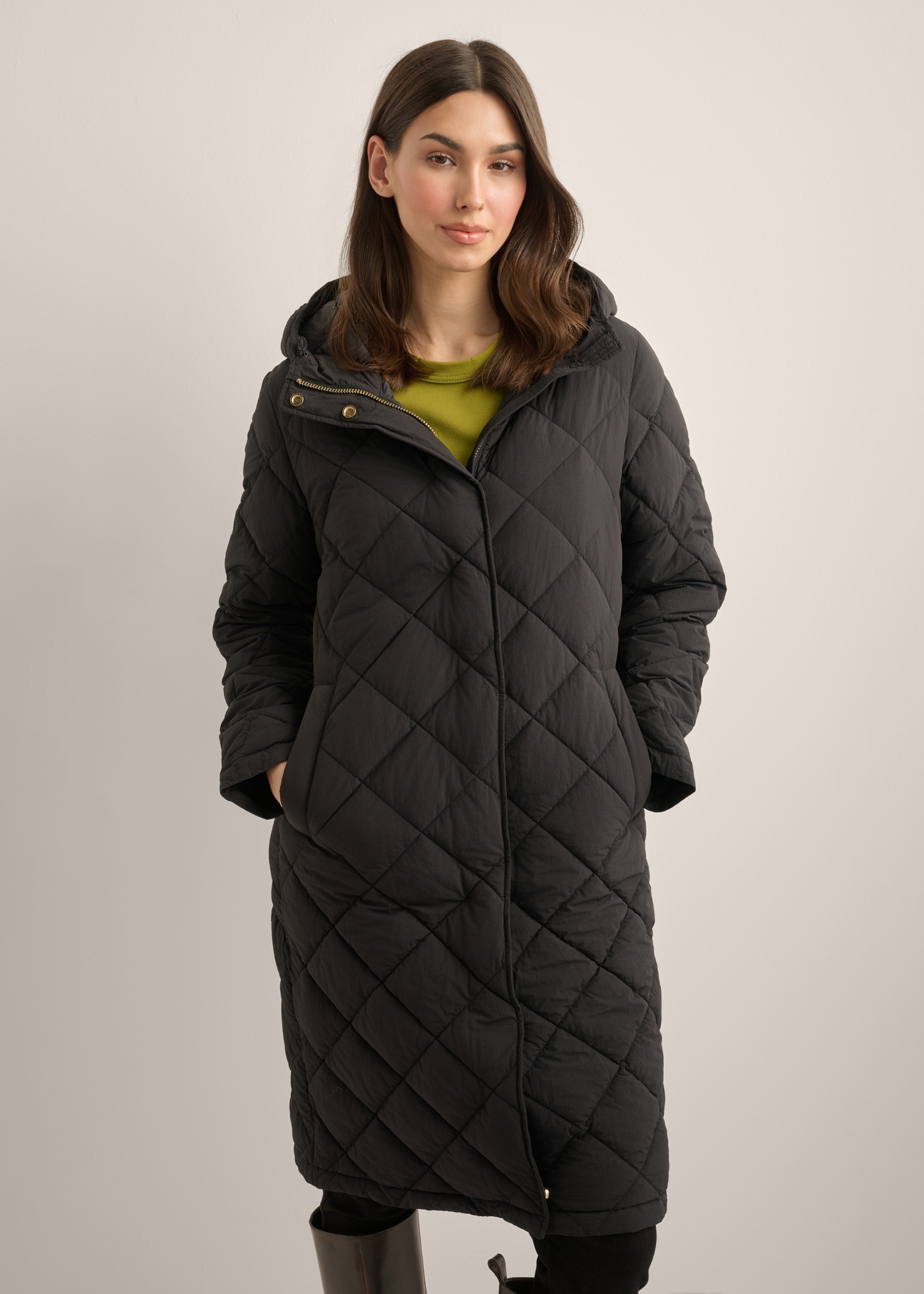 Women's black quilted jacket KURDT-0667-99(Z26), front view of the product on a model. Half of the silhouette visible.