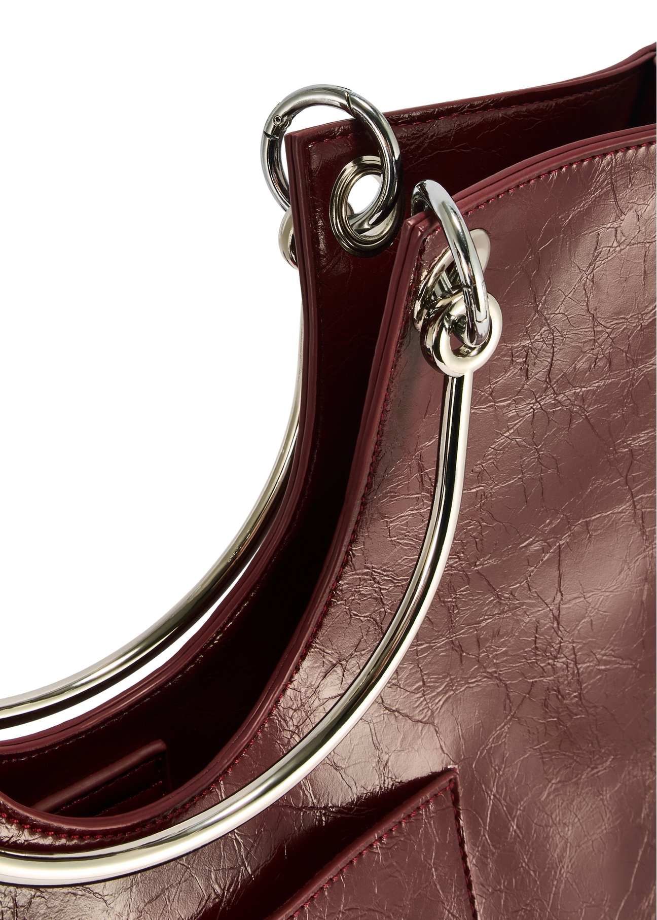 Burgundy women's handbag TOREC-0728A-49(Z25), close-up of the product handle, view on a white background.