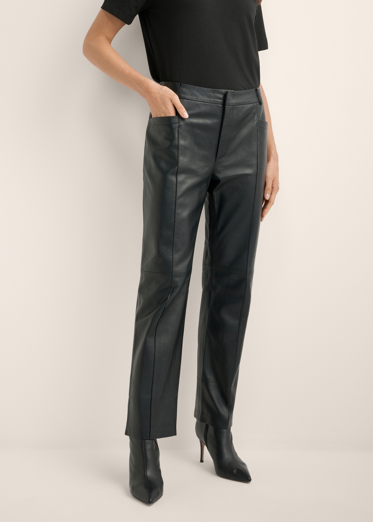 Black women's leather trousers SPODS-0048-99(Z26), product view from the front on the model, half of the silhouette visible.
