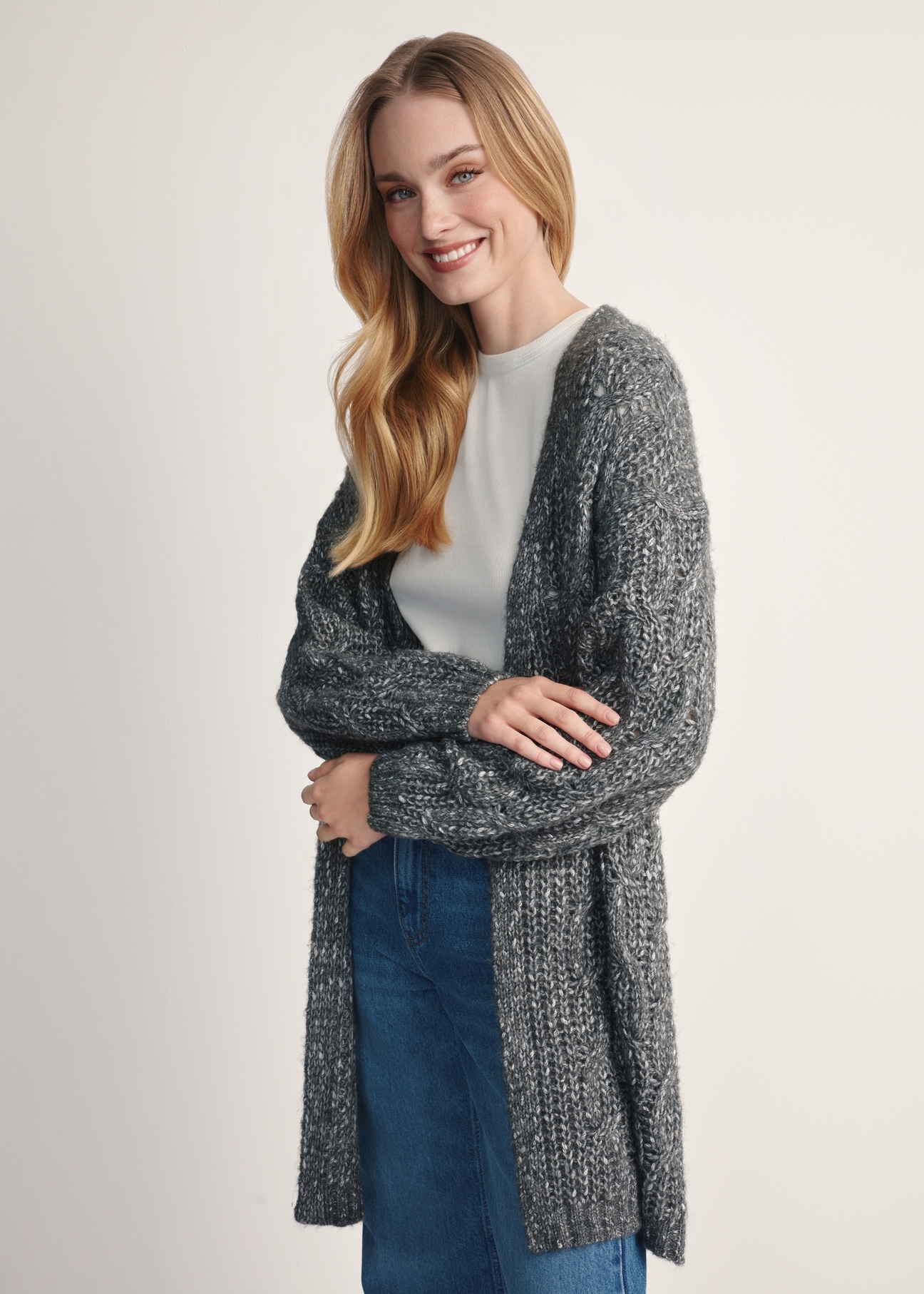 Long women's cardigan in graphite color KARDT-0055-95(Z25), product visible from the side on the model, half of the silhouette visible.