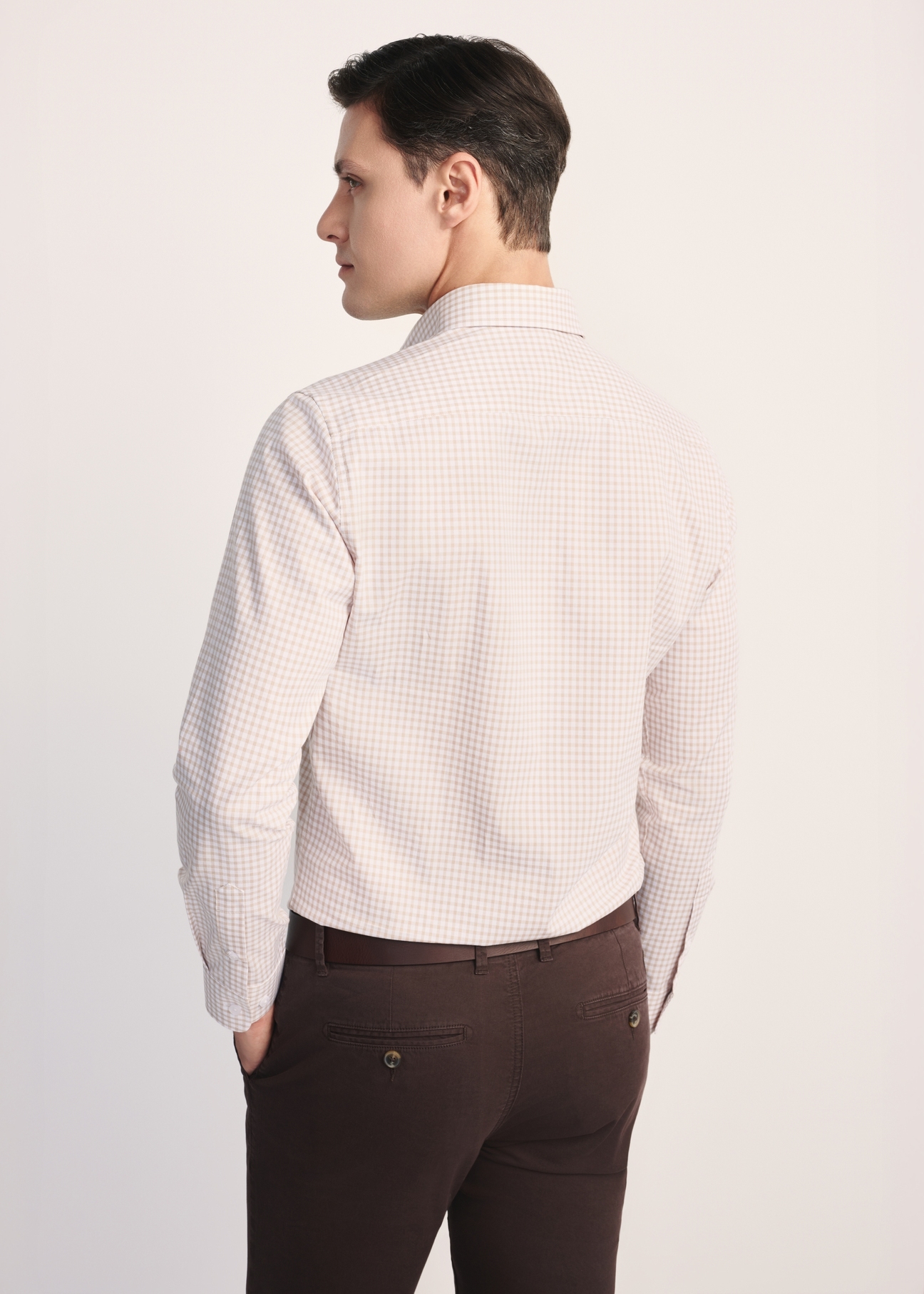 Men's cotton shirt in light beige checks KOSMT-0277-24(Z25), view of the product from the back on the model, half of the silhouette visible.