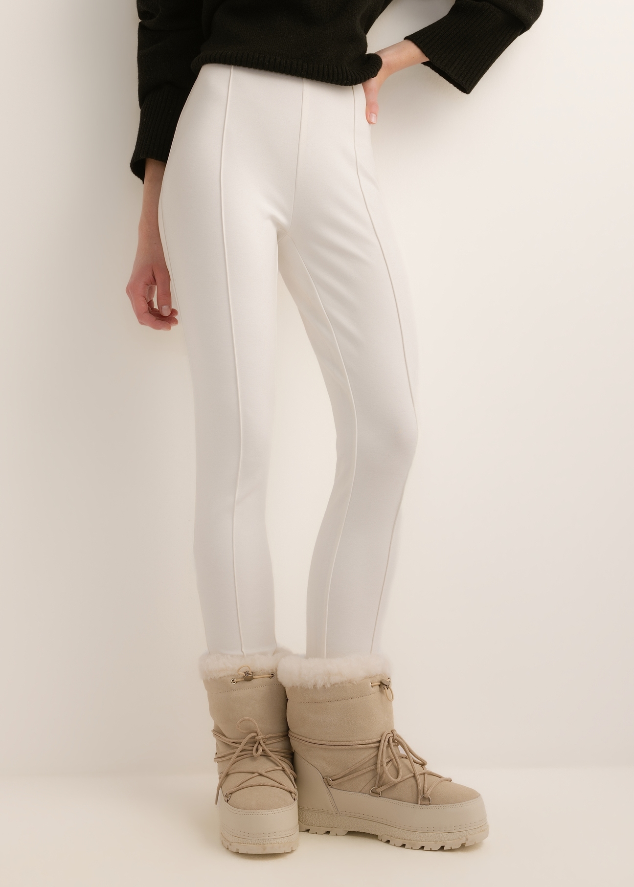 Cream-colored, fitted women's trousers SPODT-0096-0B(Z26); front view of the product on a model. Half-body shot.