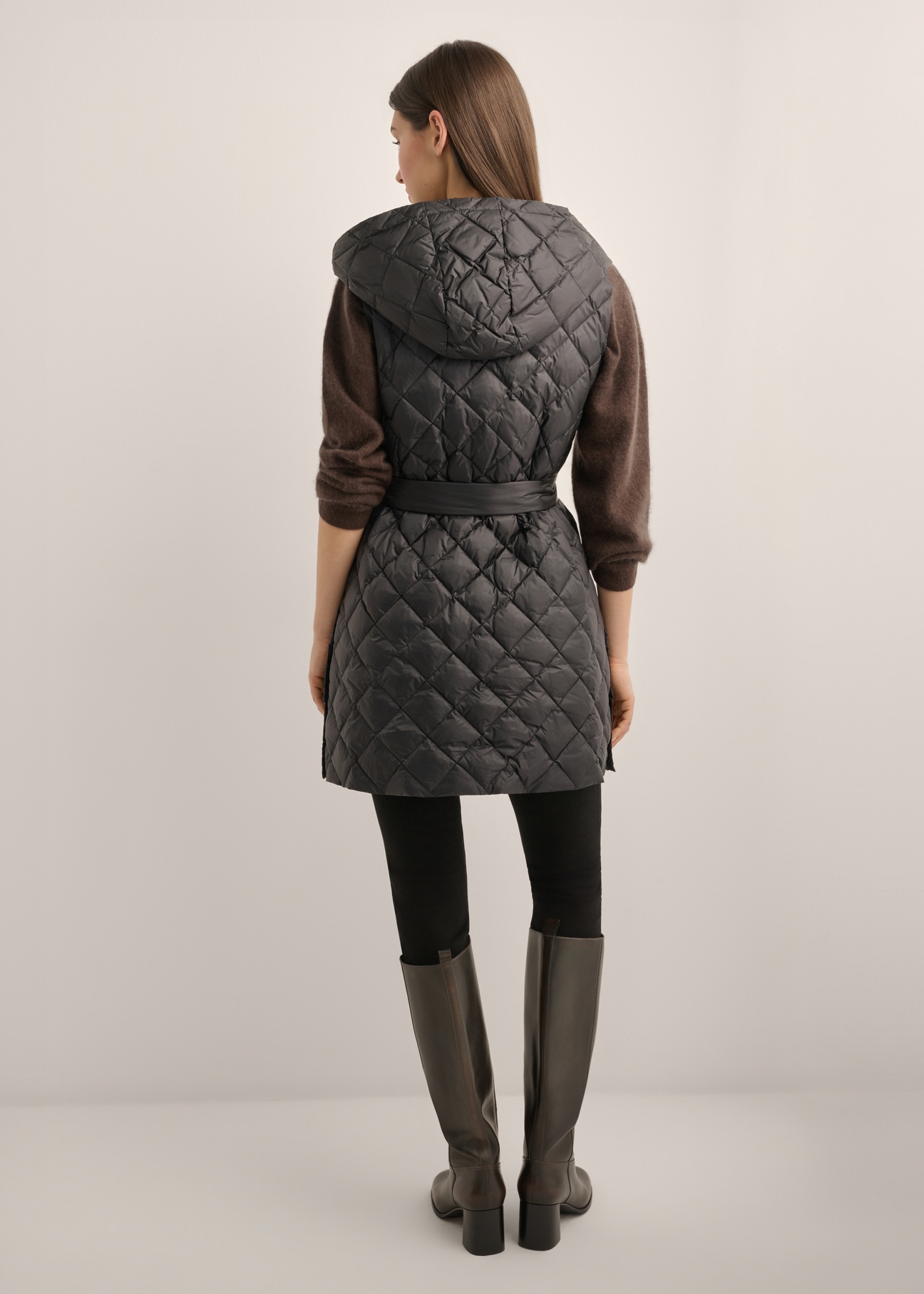 Women's black quilted vest KAMDT-0041-99(Z26), product view from the back on the model. Full body visible.