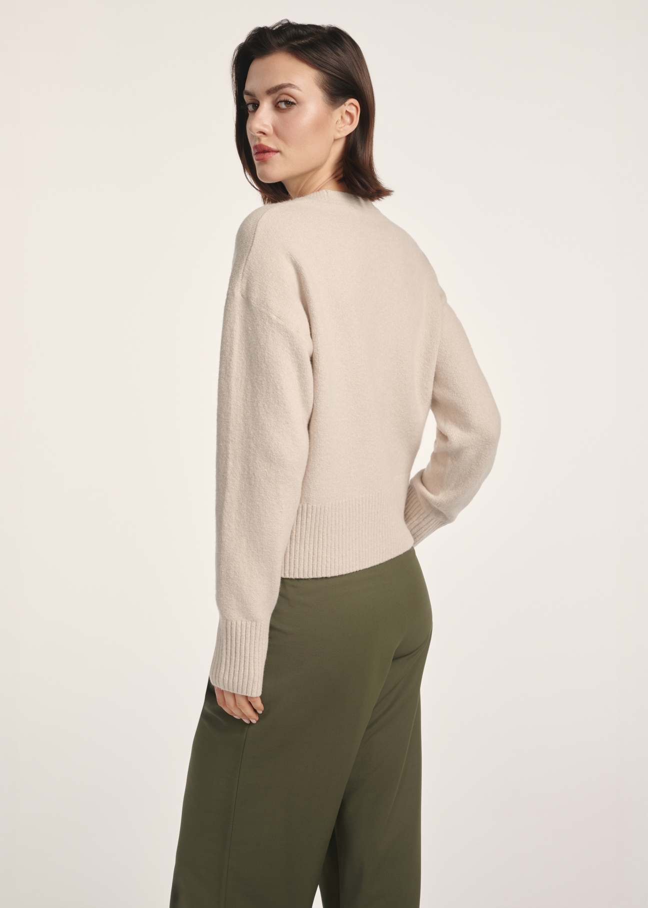 Beige women's sweater SWEDT-0242-80(Z25), product view from the back on the model. Half of the silhouette visible.
