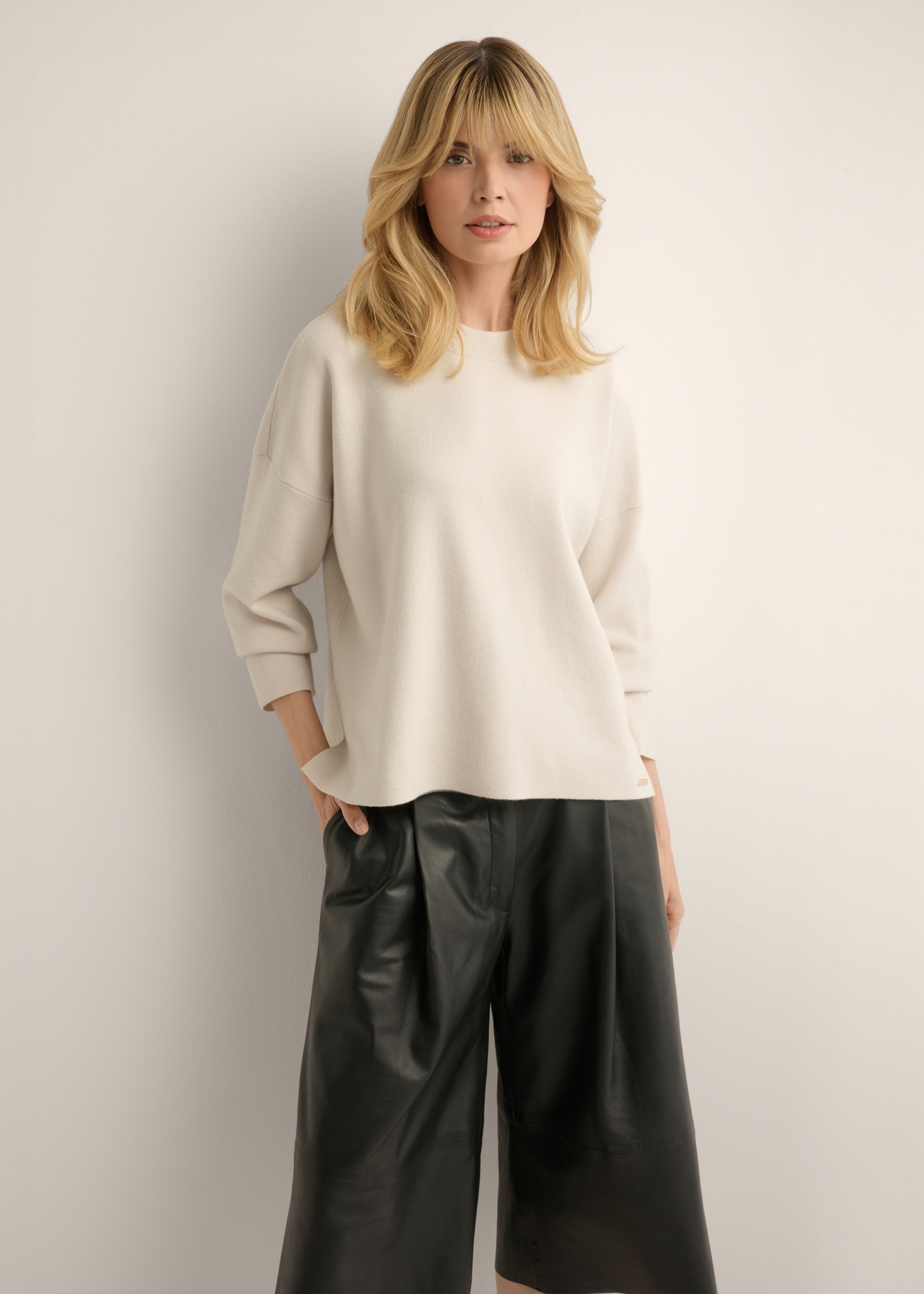 Light beige women's sweater SWEDT-0263-1A(Z26), front view of the product on the model. Half of the silhouette visible.