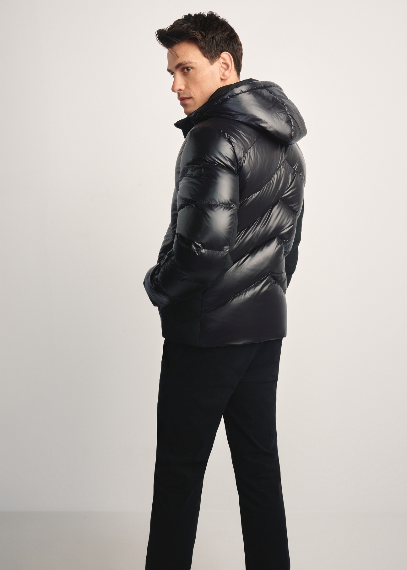 Men's black jacket with natural insulation KURMT-0393-99(Z25) - product view from the back of the model, against a white background. Full body visible.