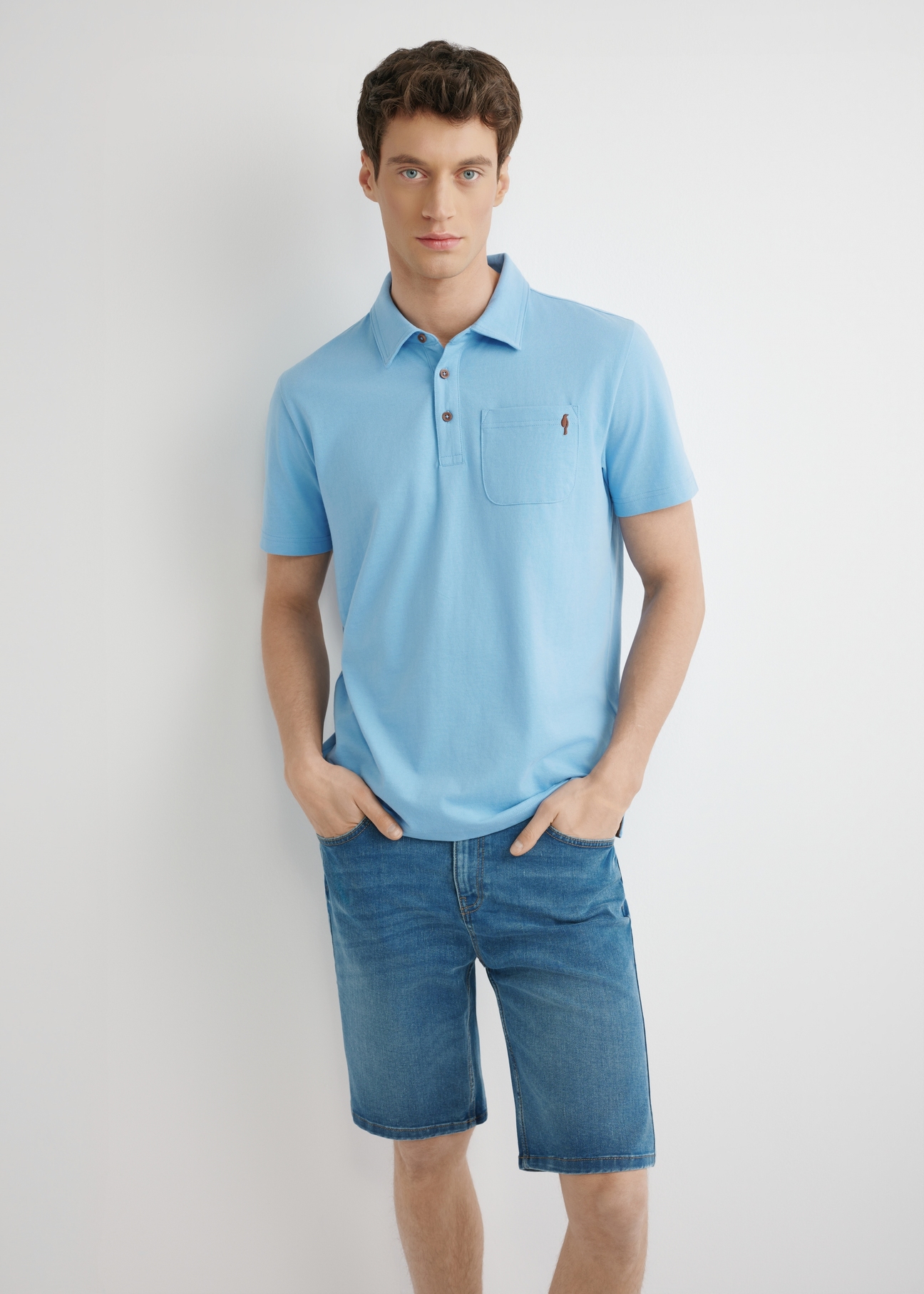 Blue men's polo shirt POLMT-0088-7B(W26), front view of the product on the model. Half of the silhouette visible.