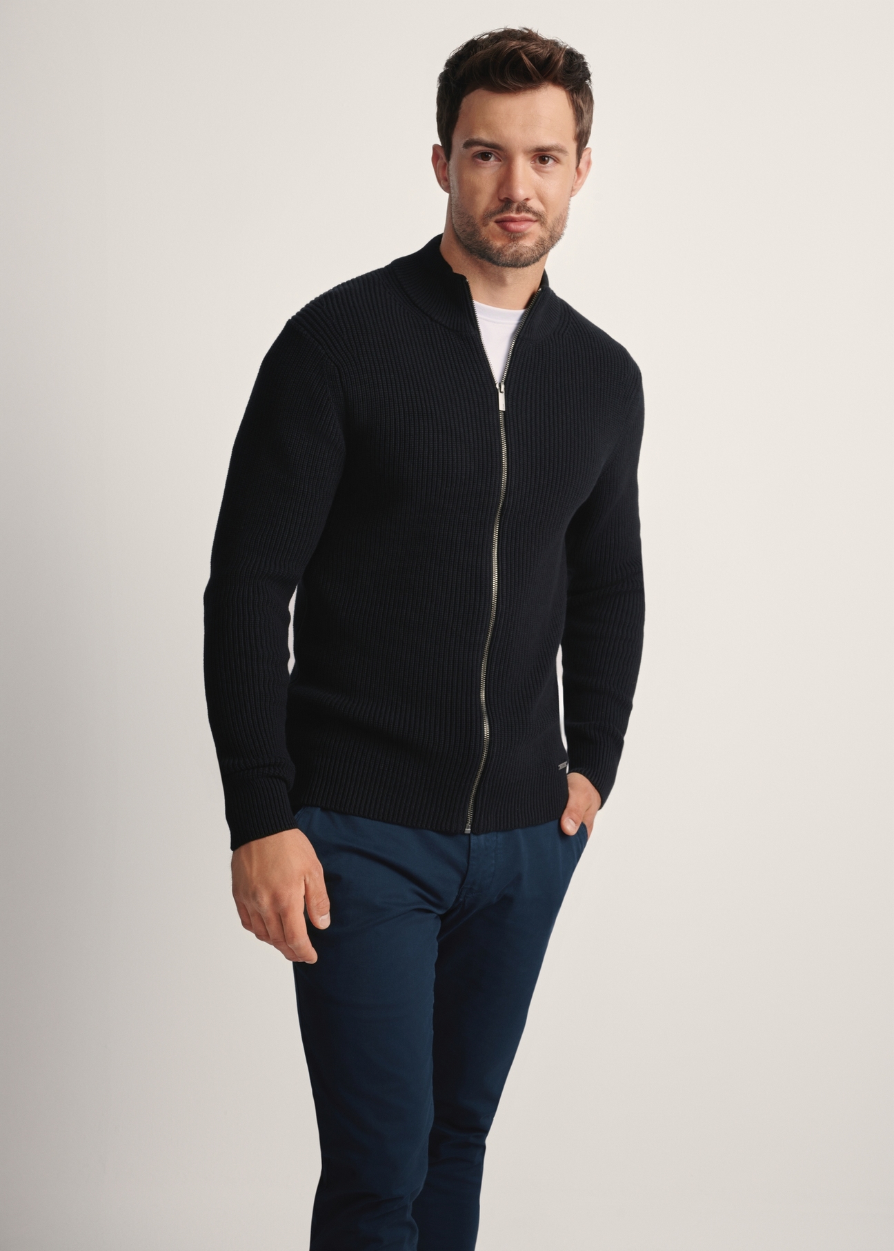 Black men's sweater with zipper SWEMT-0176-99(Z25), front view of the product on the model. Half of the silhouette visible.