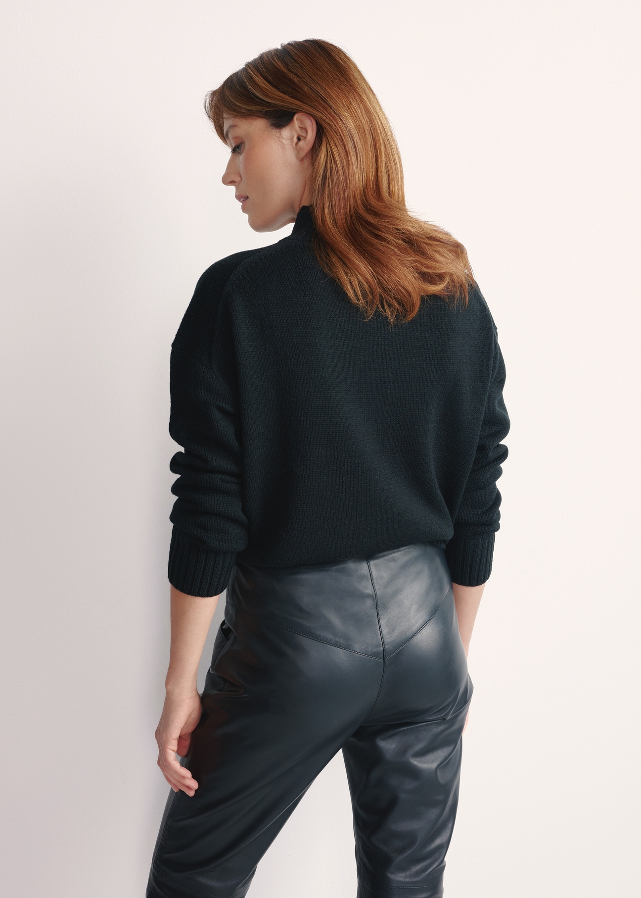 Black classic women's sweater SWEDT-0186 A-99(Z 25), product view from the back on the model, half of the silhouette visible.