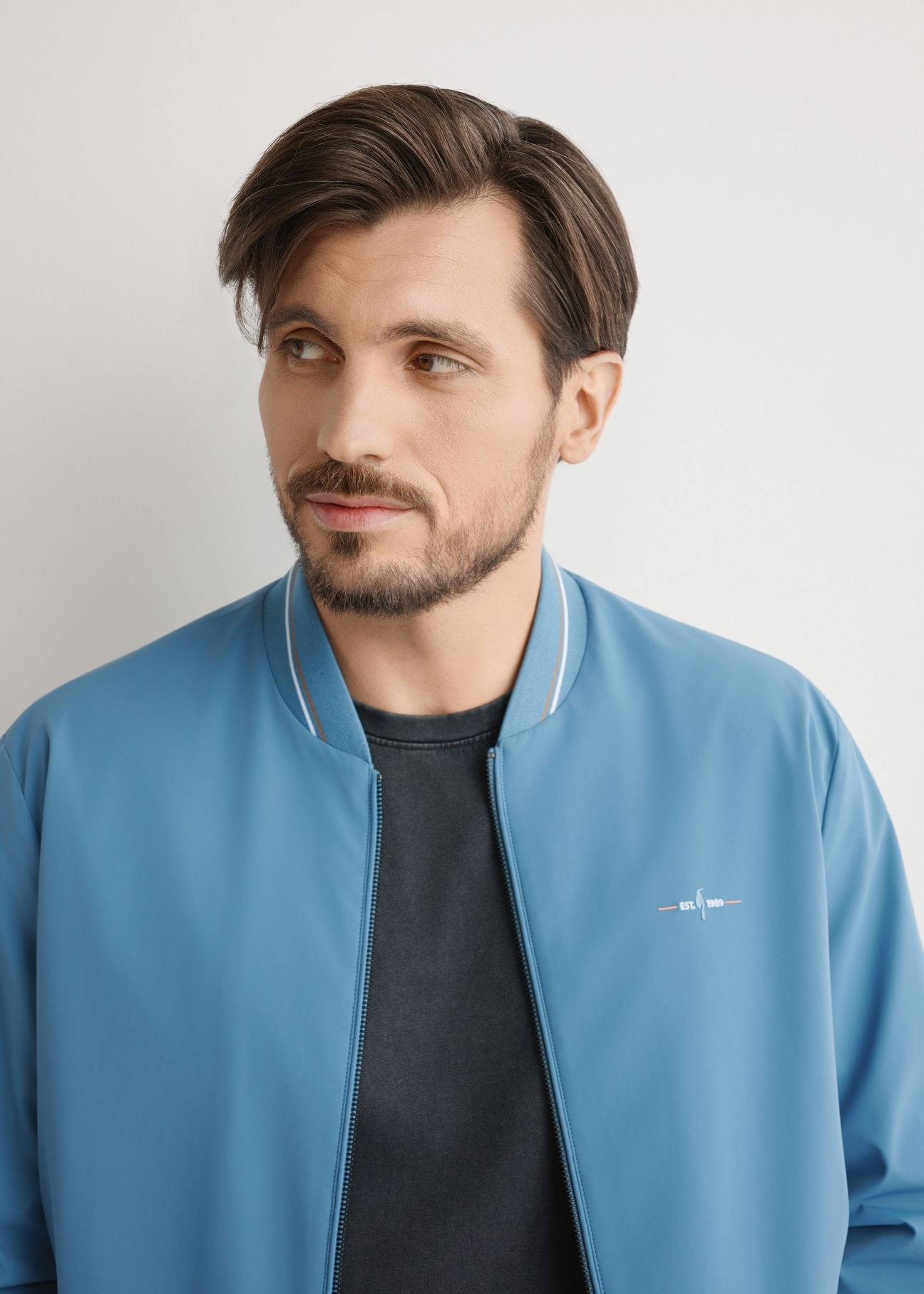 Blue men's nylon jacket KURMT-0416-7C(W26), close-up of the product on the model's silhouette.