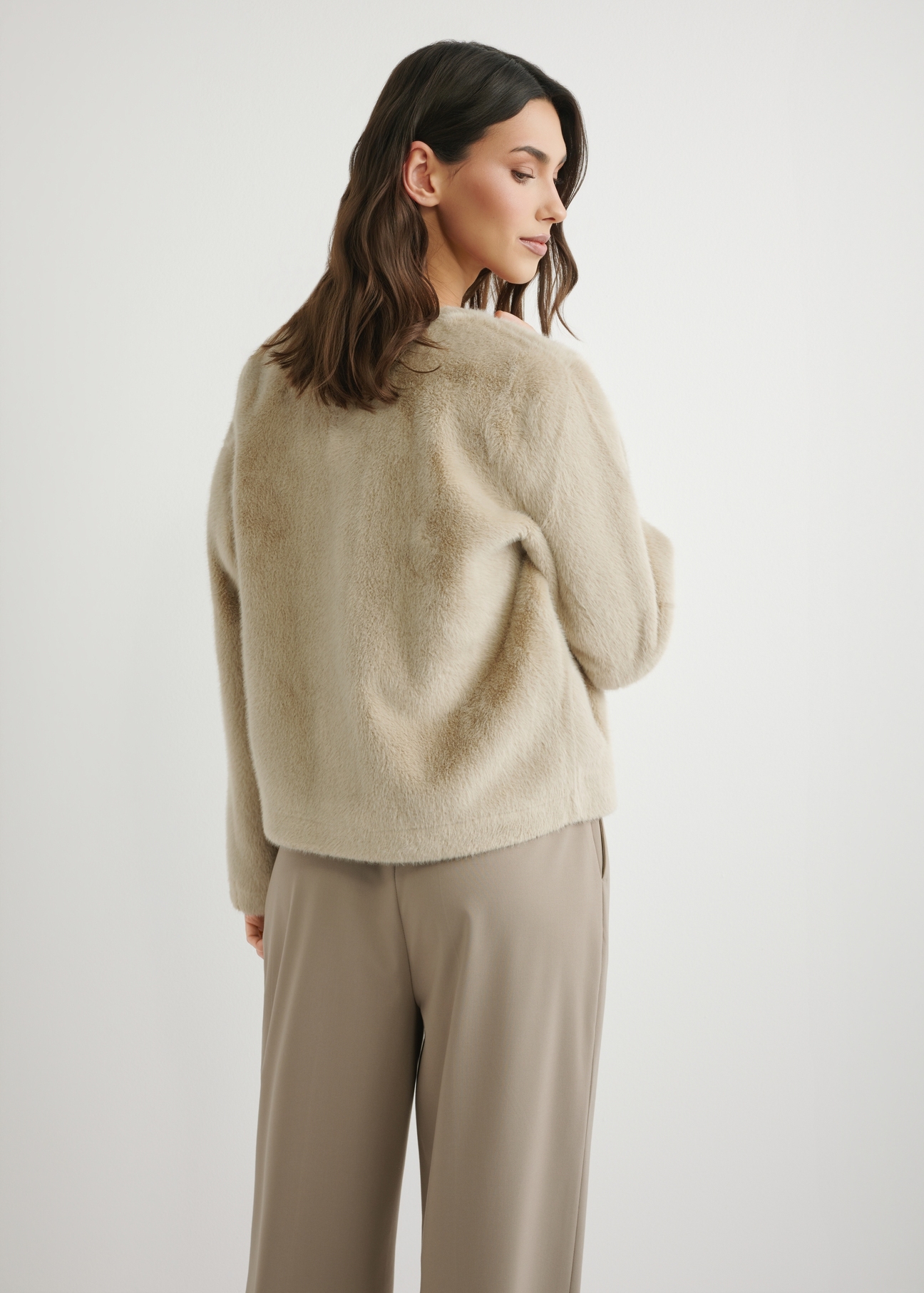 Women's short beige fur coat FUTDP-0079-1A(W26), back view of the product on the model. Half of the silhouette visible.