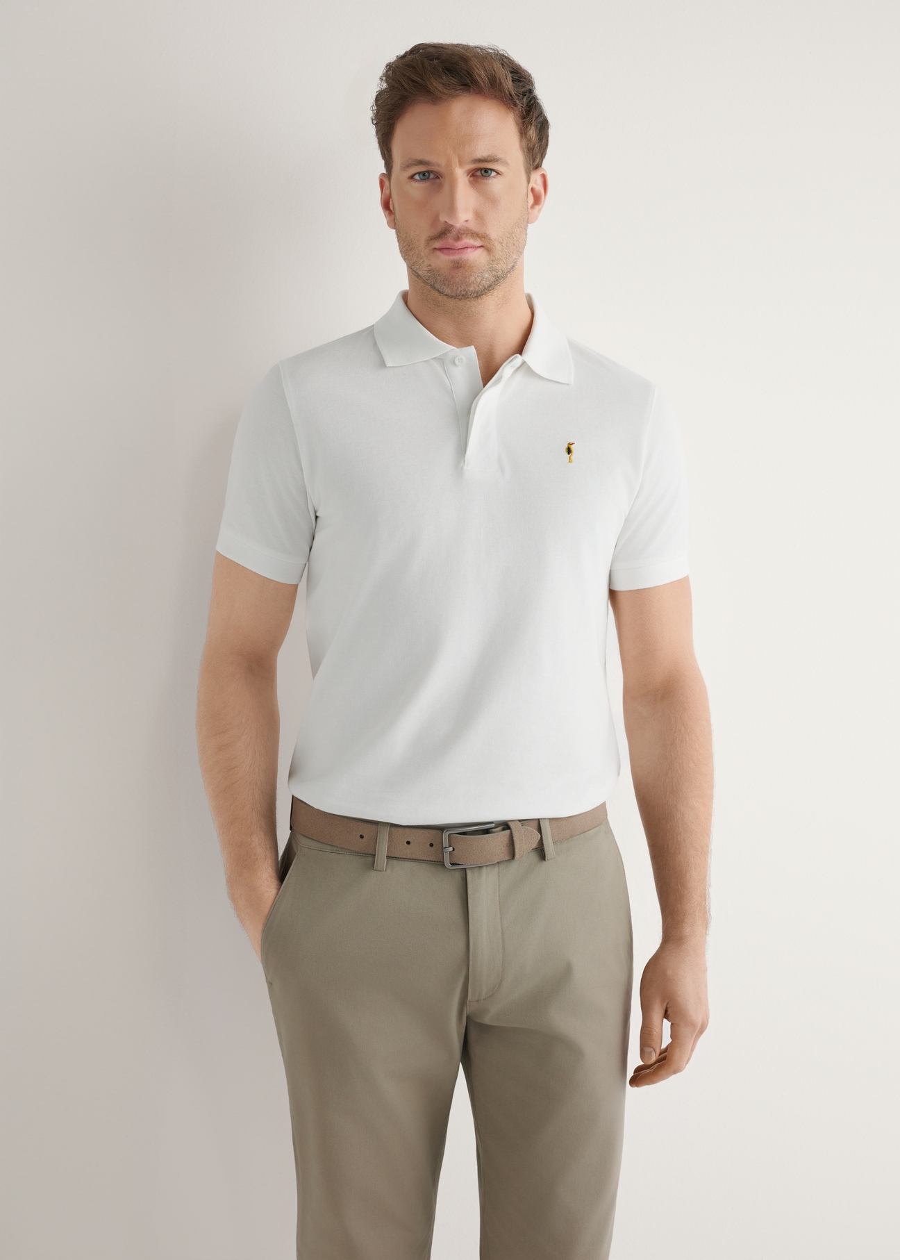 Cream cotton polo shirt POLMT-0086-0B(W26), front view of the product on the model. Half of the silhouette visible.