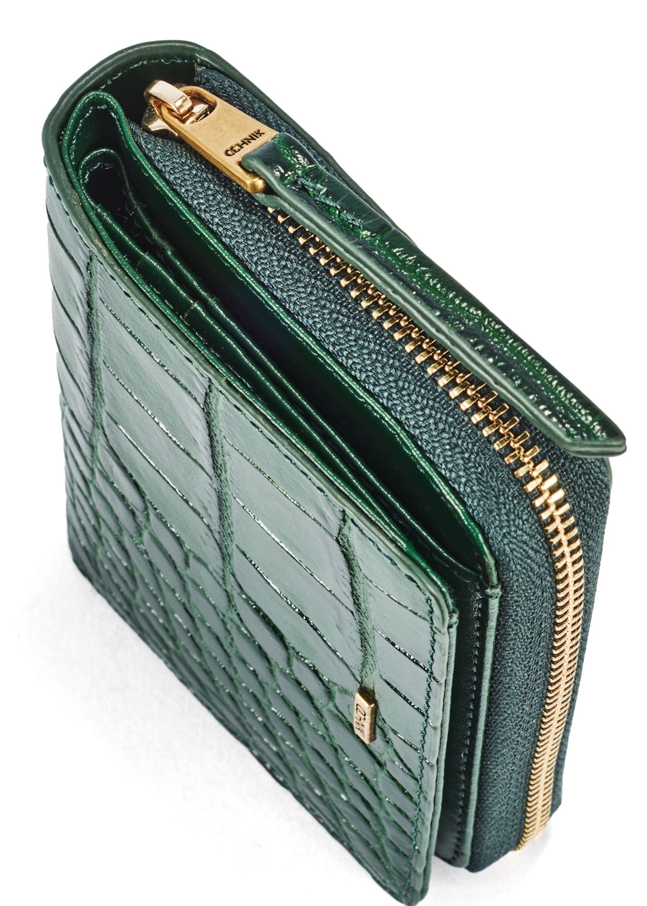 Dark green croco women's wallet PORES-0951-51(W25) - close-up of detail on white background.