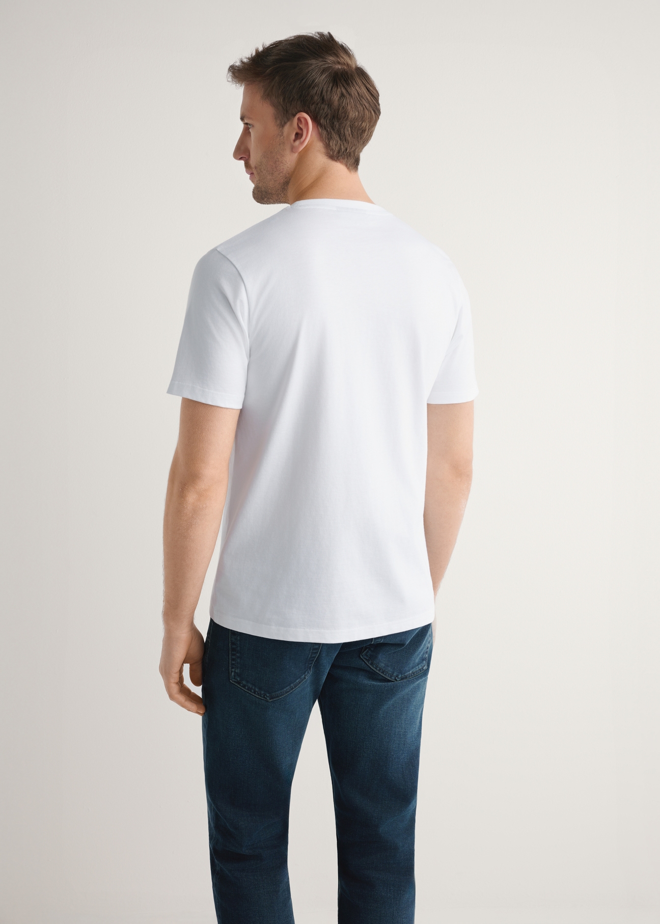 Men's white cotton t-shirt TSHMT-0144-0A(W26) - back view of the product on the model, against a light background. Half-length silhouette visible.