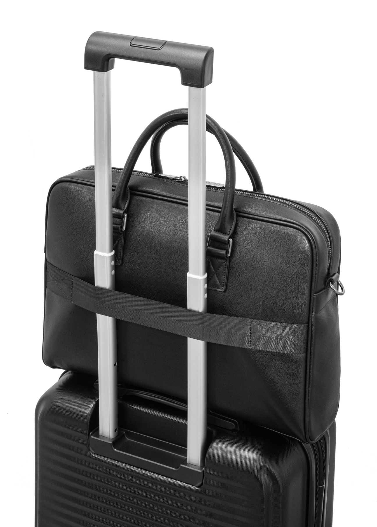 Black leather laptop bag TORMS-0494-99(W26) - close-up detail, on suitcase, on white background.